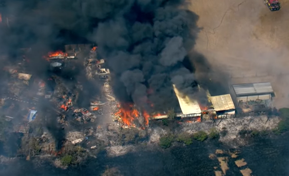 Houses are ablaze after a huge grass fire broke out in Dartford , Kent