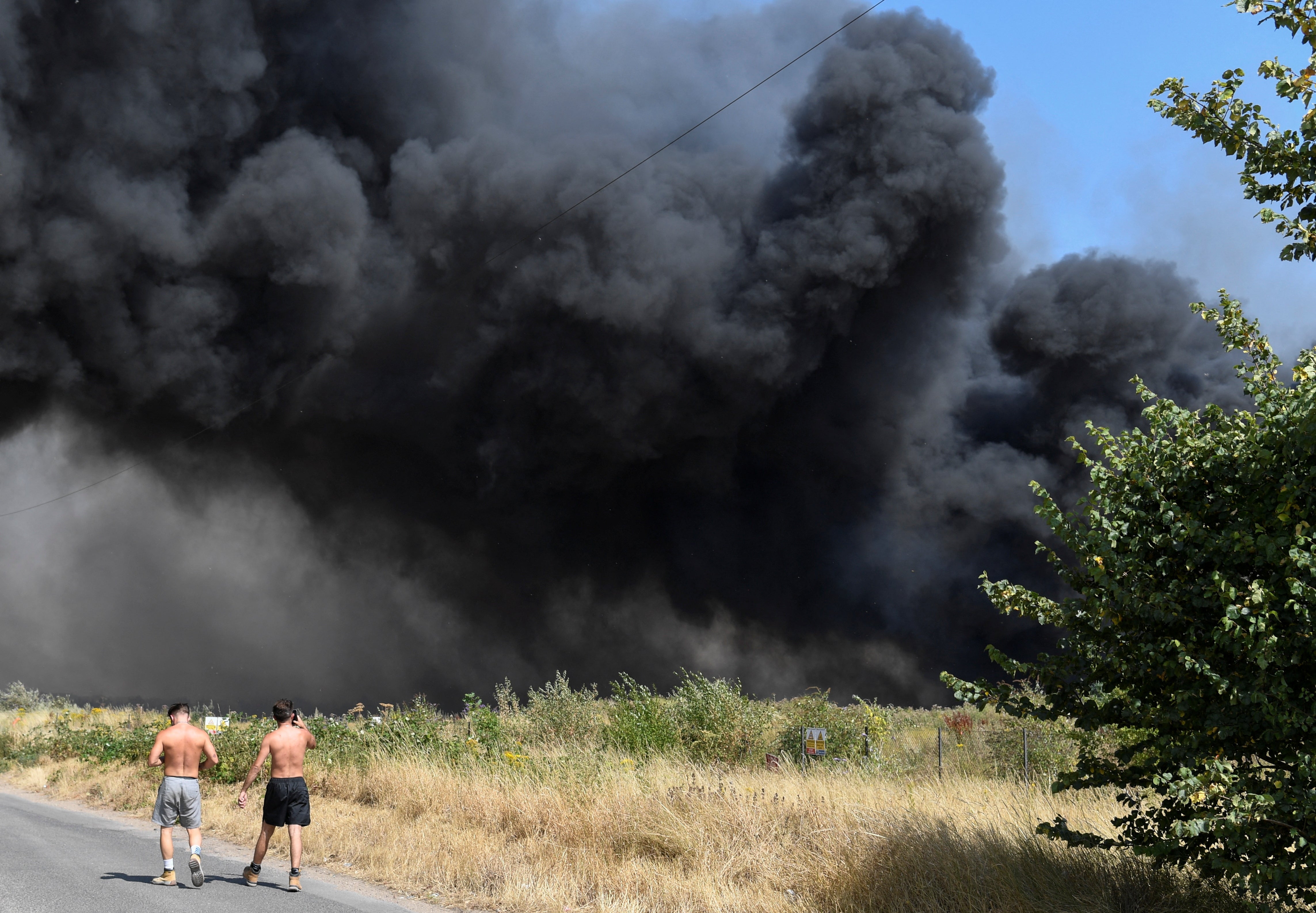 Pedestrians near the fire in Wennington