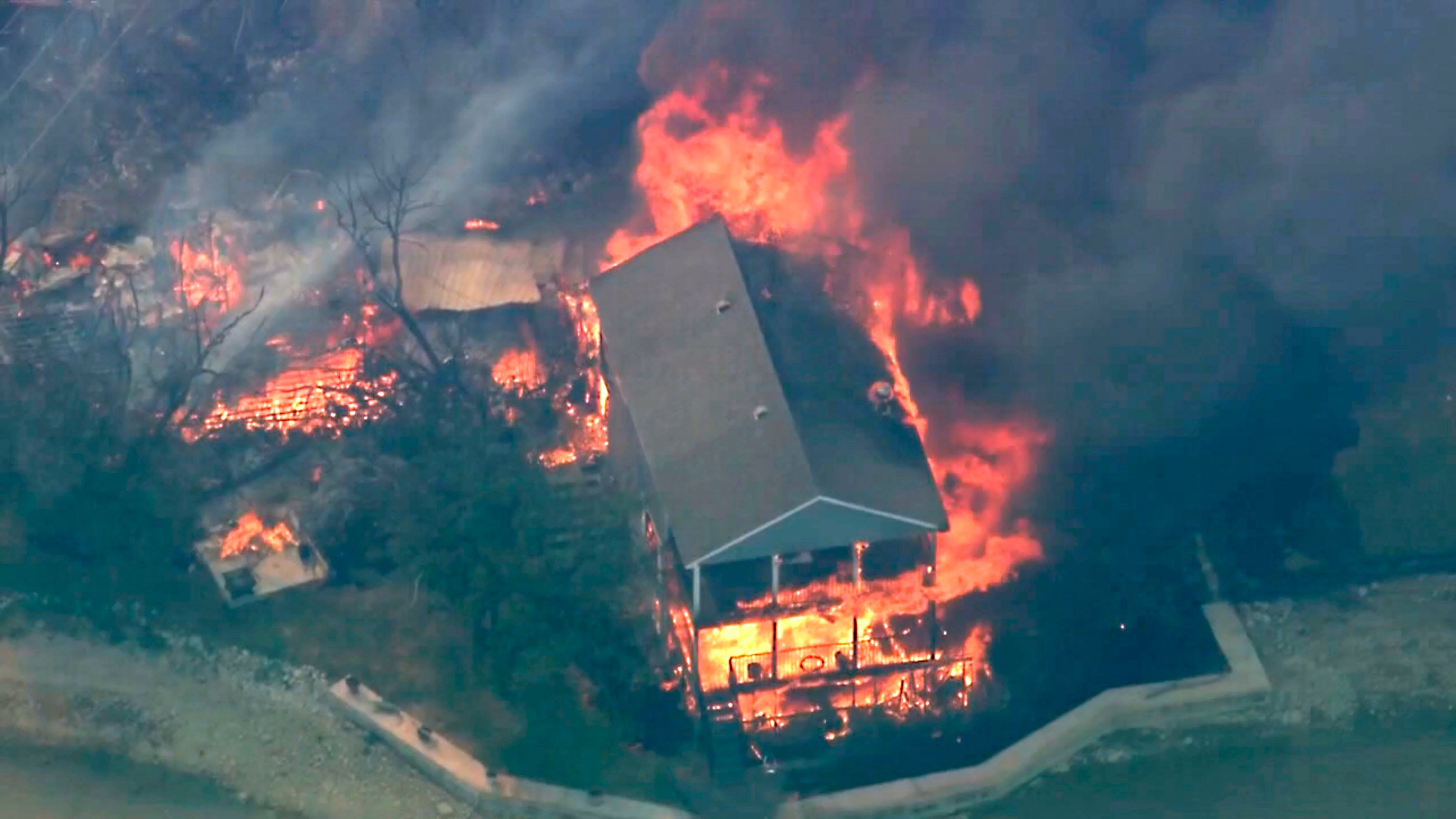 A wildfire in North Texas may have been started by sunlight igniting trash, an official says