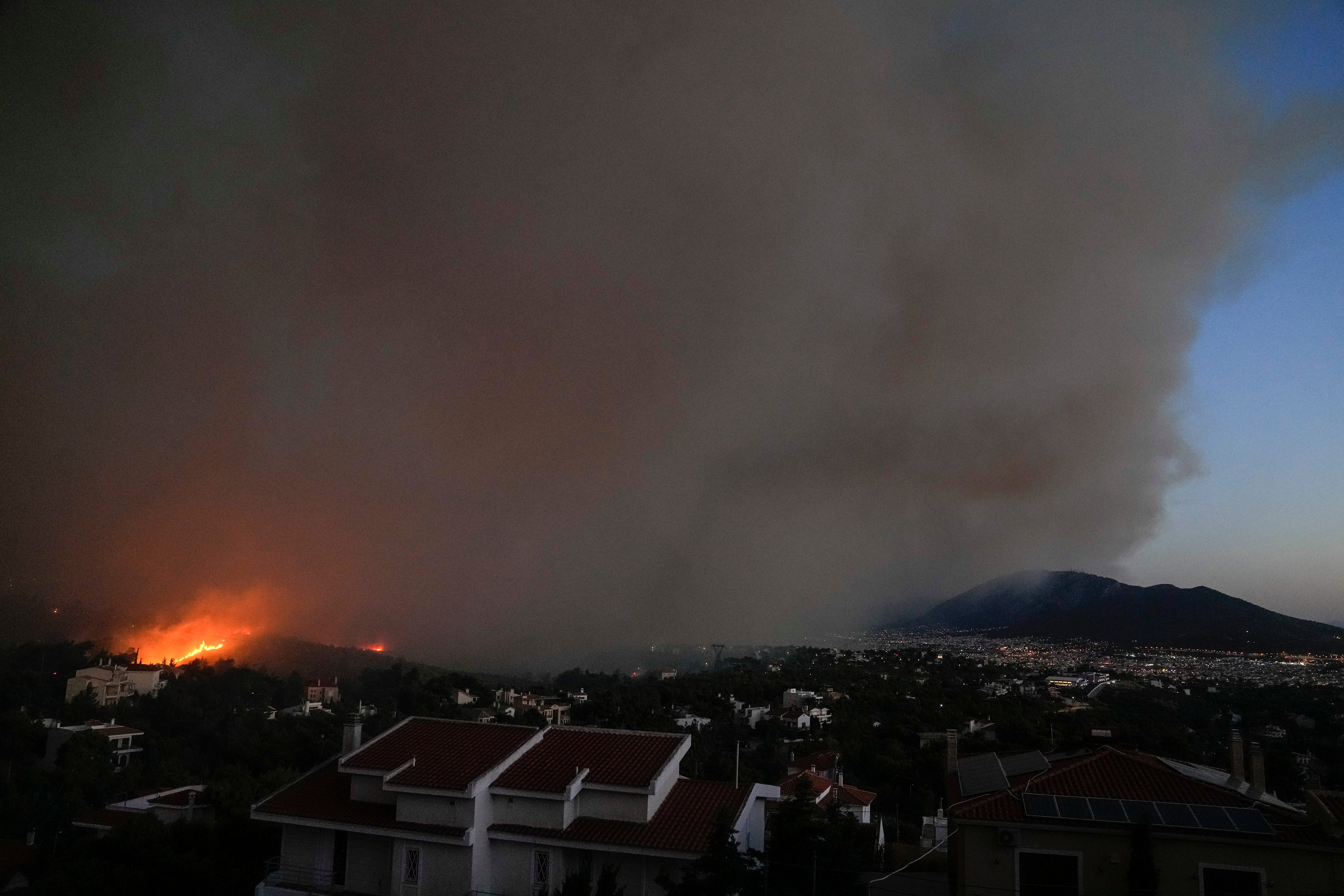 Fire burns at the mount of Penteli, in the suburbs of Athens