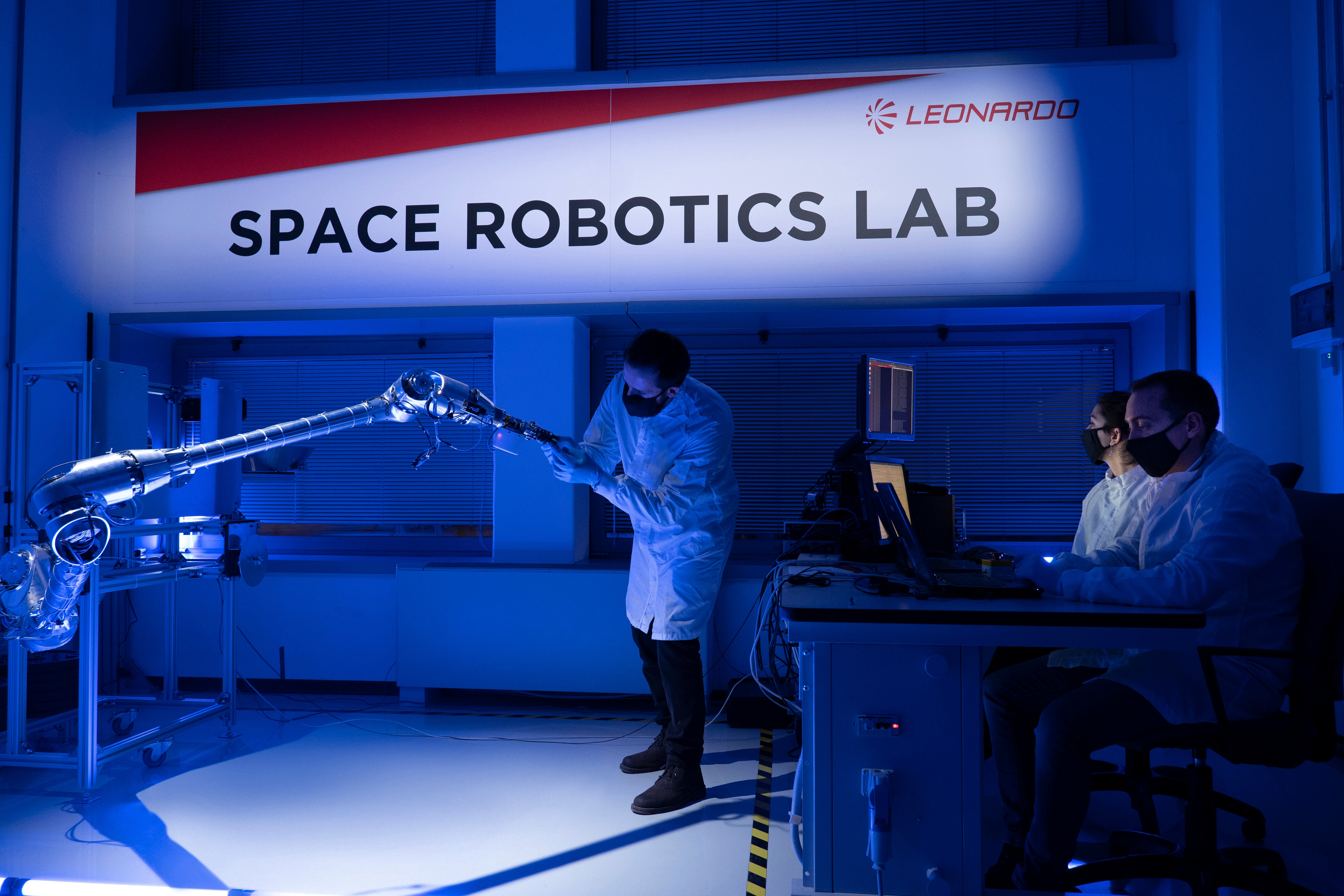 A prototype of the Sample Transfer Arm, a complex robotic appendage destined to retrieve samples of Martian soil from the surface of the Red Planet