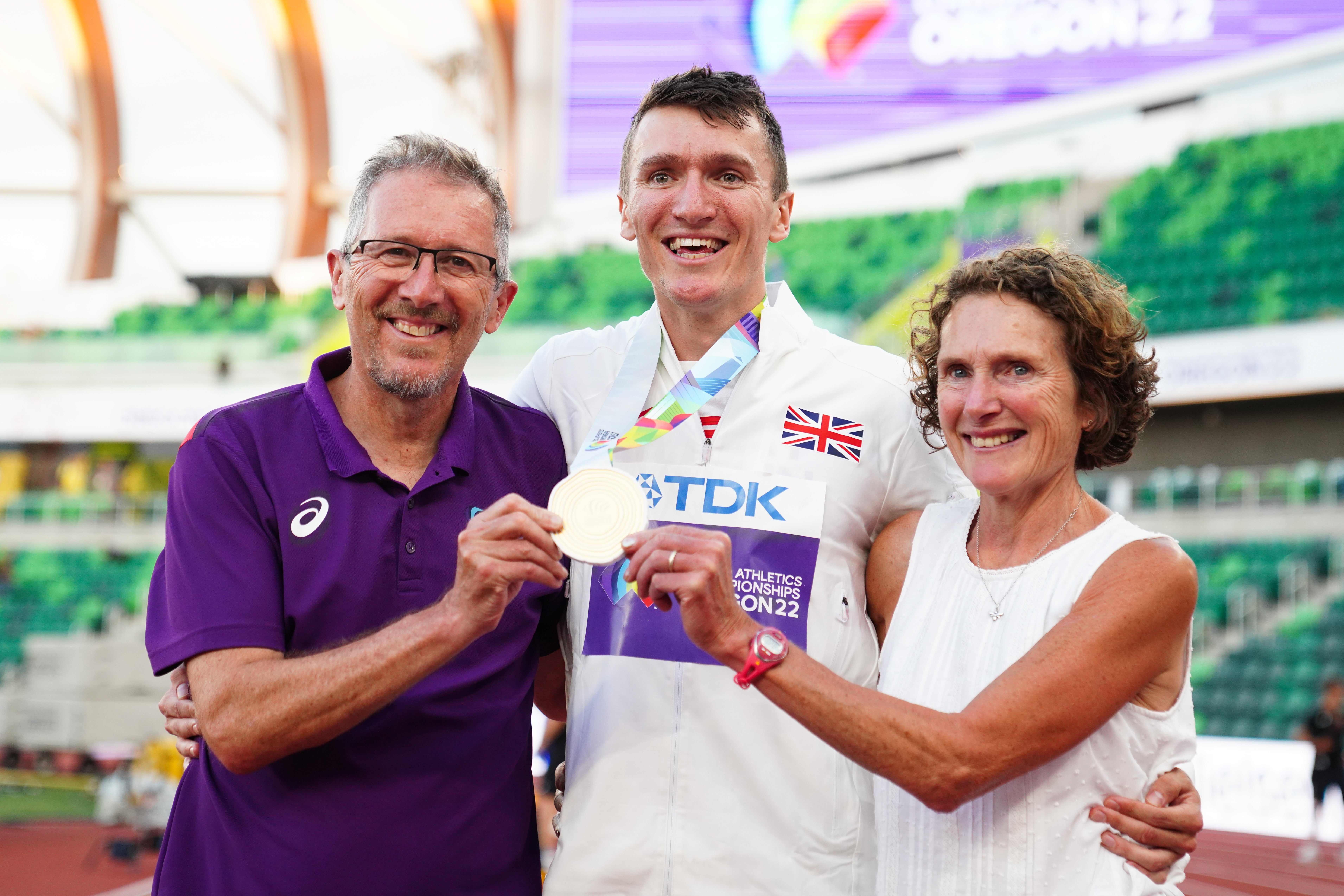 Mum Susan and dad and coach Geoff celebrate with their son (Martin Rickett/PA)
