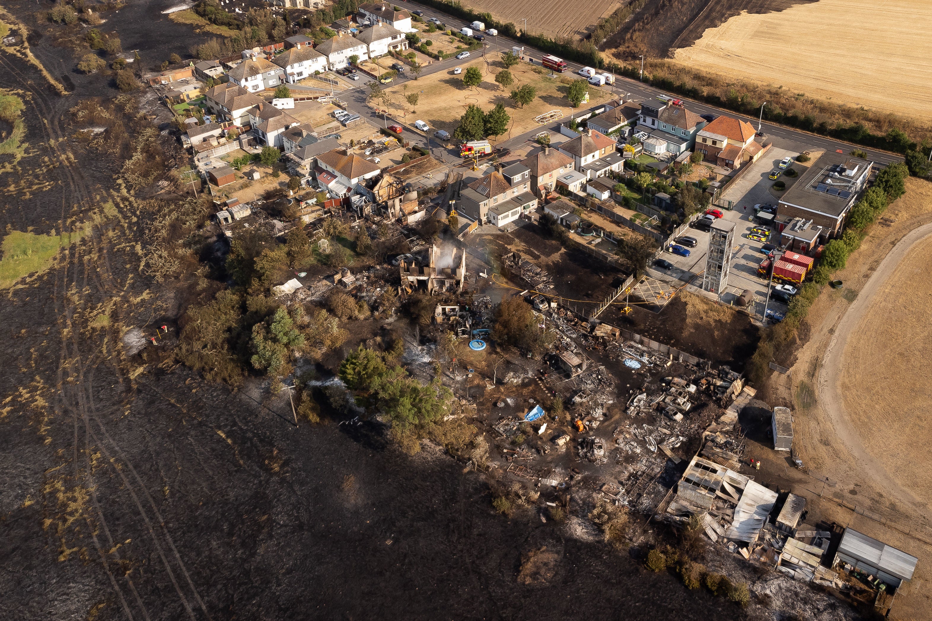 The scene after a blaze in the village of Wennington, east London after temperatures topped 40C in the UK for the first time ever, as the sweltering heat fuelled fires and widespread transport disruption. Picture date: Wednesday July 20, 2022. PA Photo. See PA story WEATHER Heatwave. Photo credit should read: Aaron Chown/PA Wire