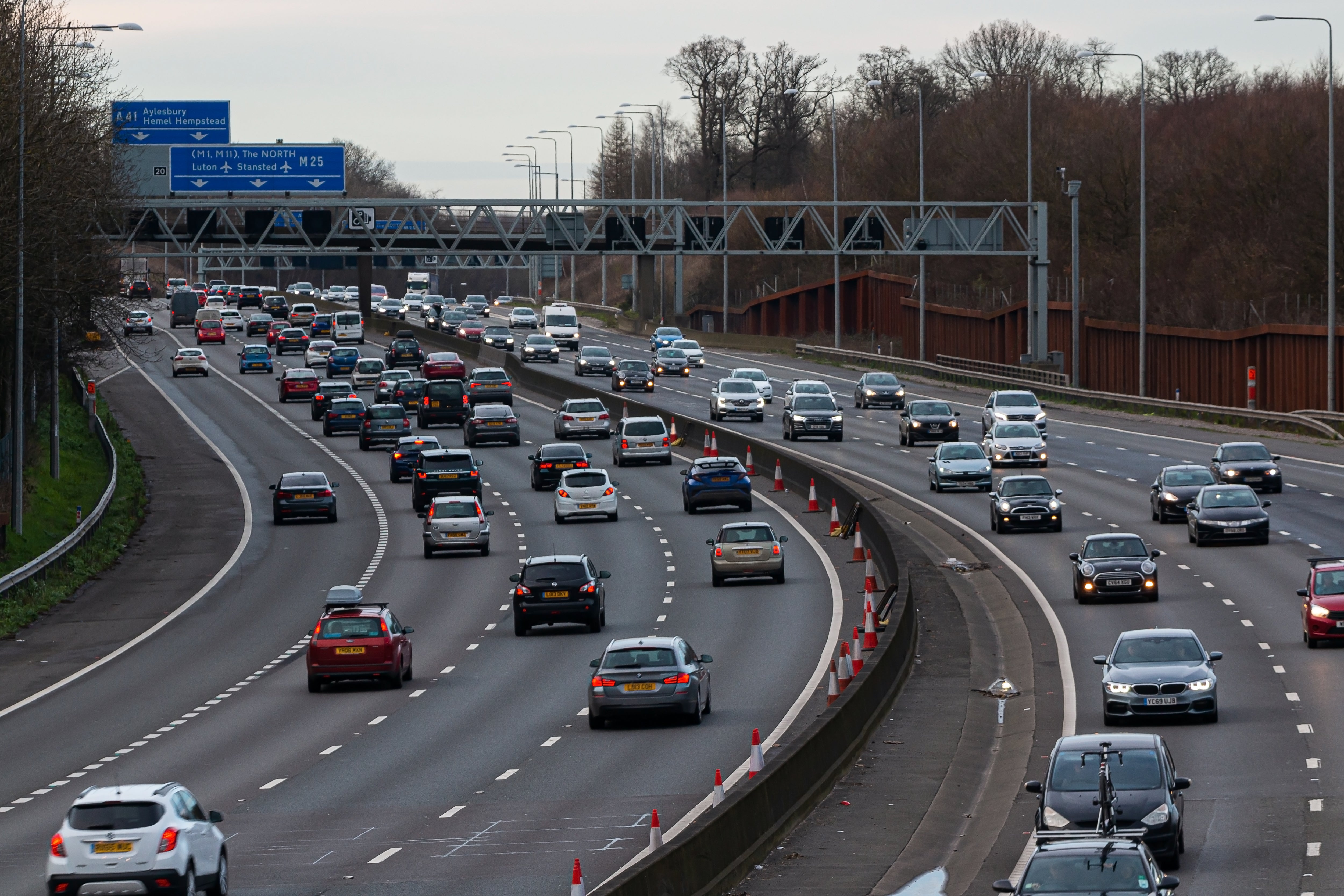 Two people have died and motorway is closed after car hits central reservation