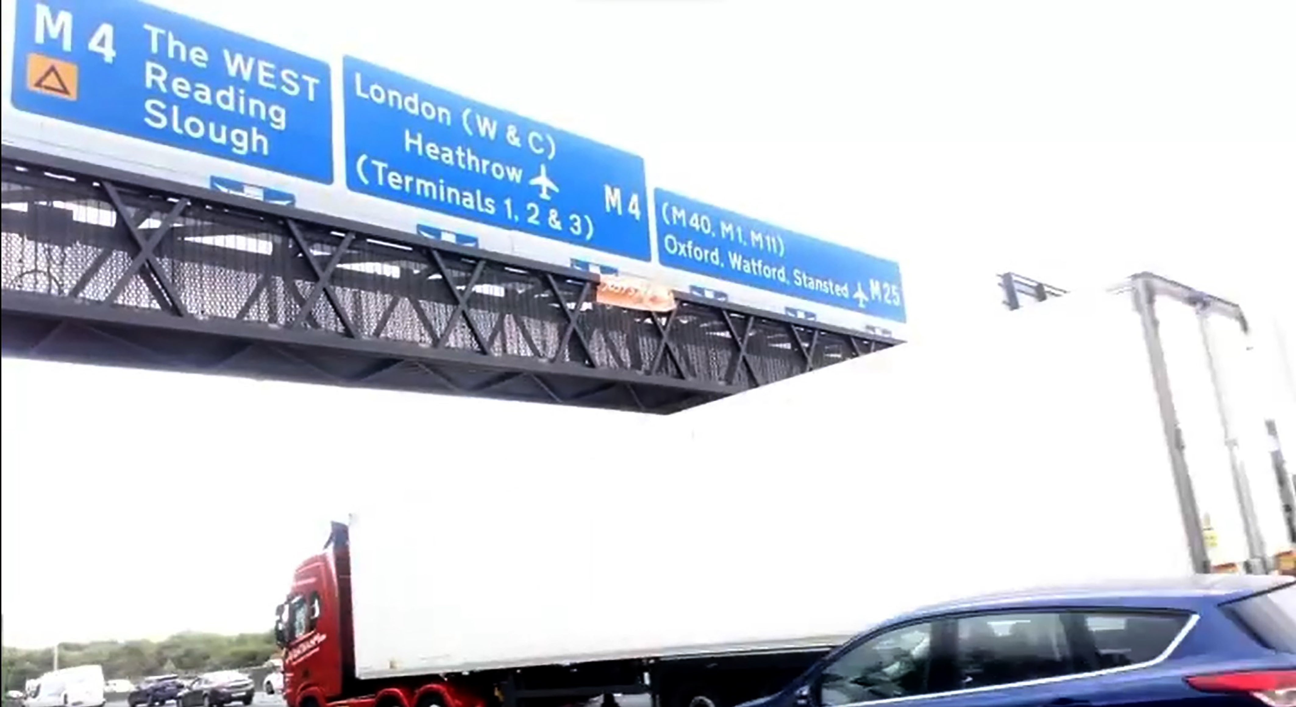 Just Stop Oil activists climbed motorway signs on the M25 (handout/PA)