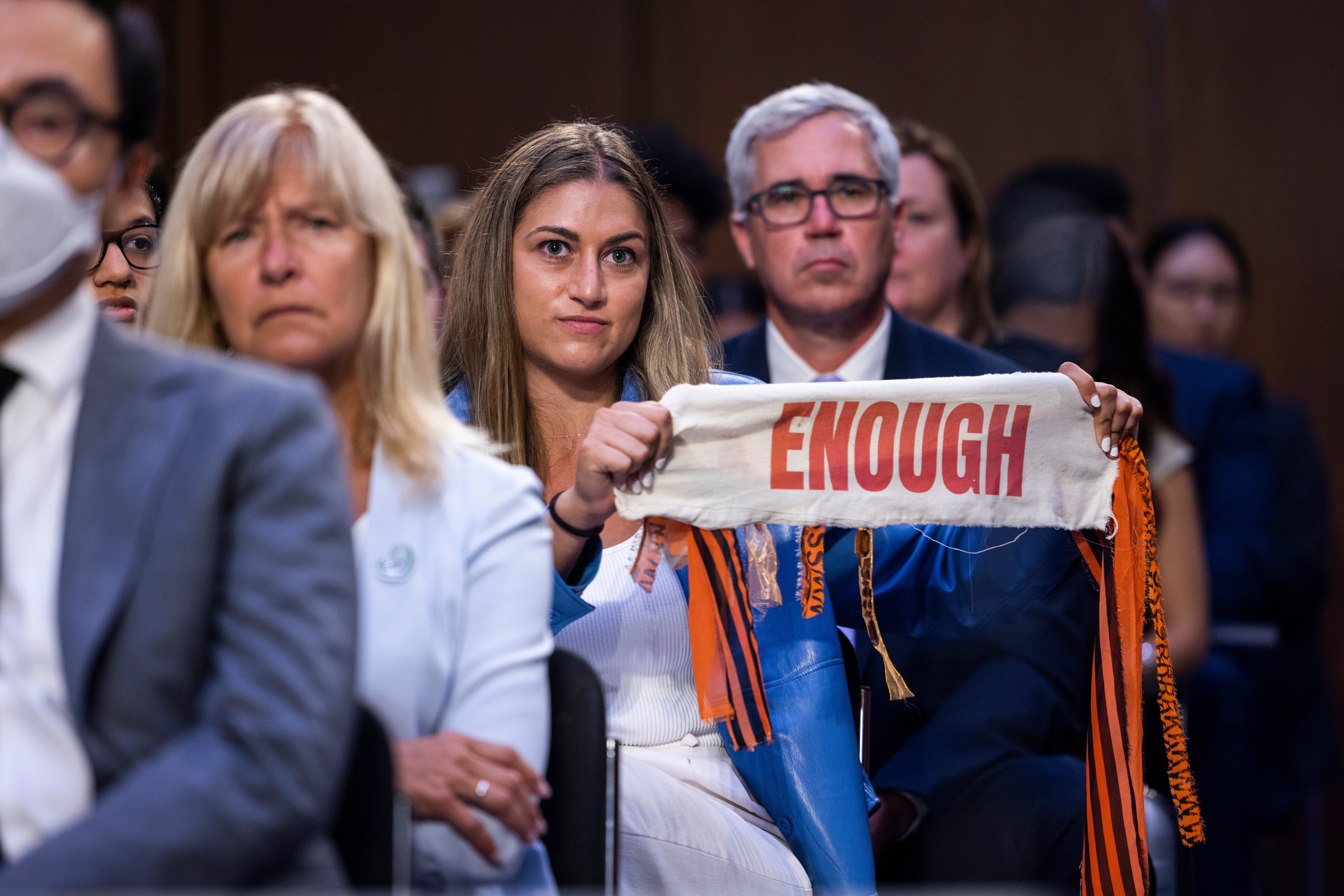 Allie Rubin of Highland Park, Illinois holds a ribbon during a Senate Judiciary Committee hearing on assault weapons on 20 July.