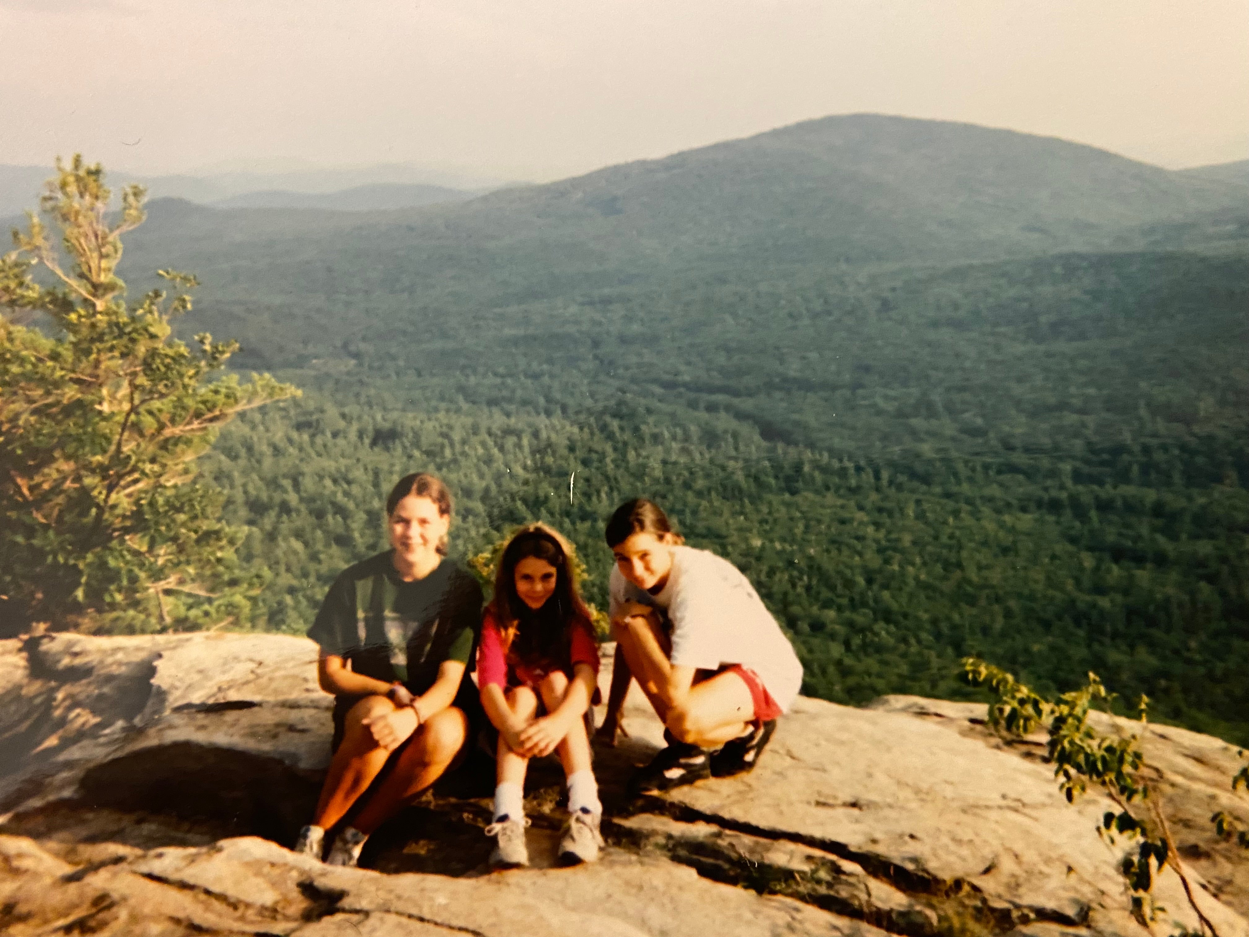 Maura Murray, left, poses in the mountains as a teen, just a few years before her baffling disappearance in New Hampshire in 2004