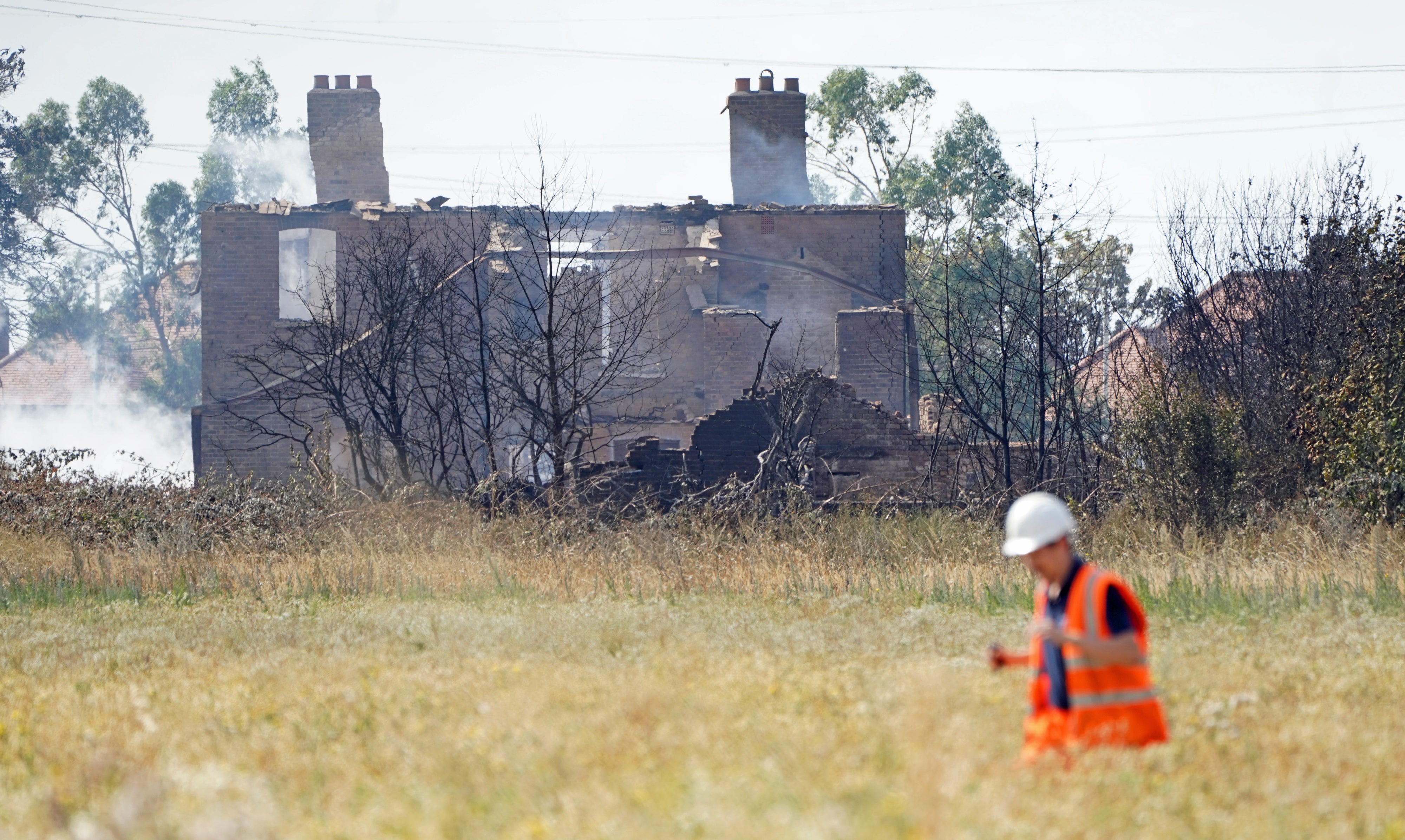 The scene after a blaze in the village of Wennington (PA)