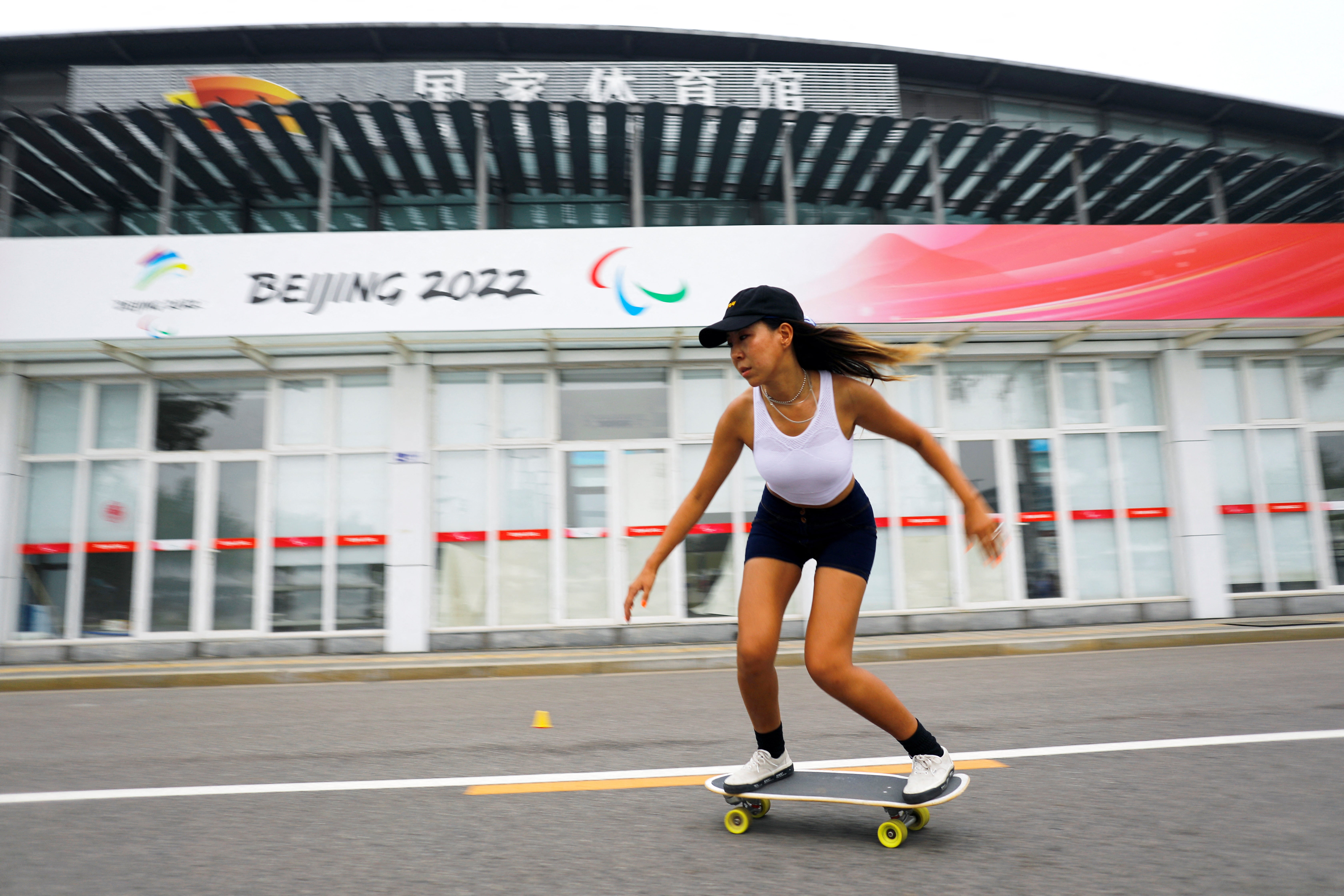 Duo Lan rides a skateboard during a free weekly training session in Beijing