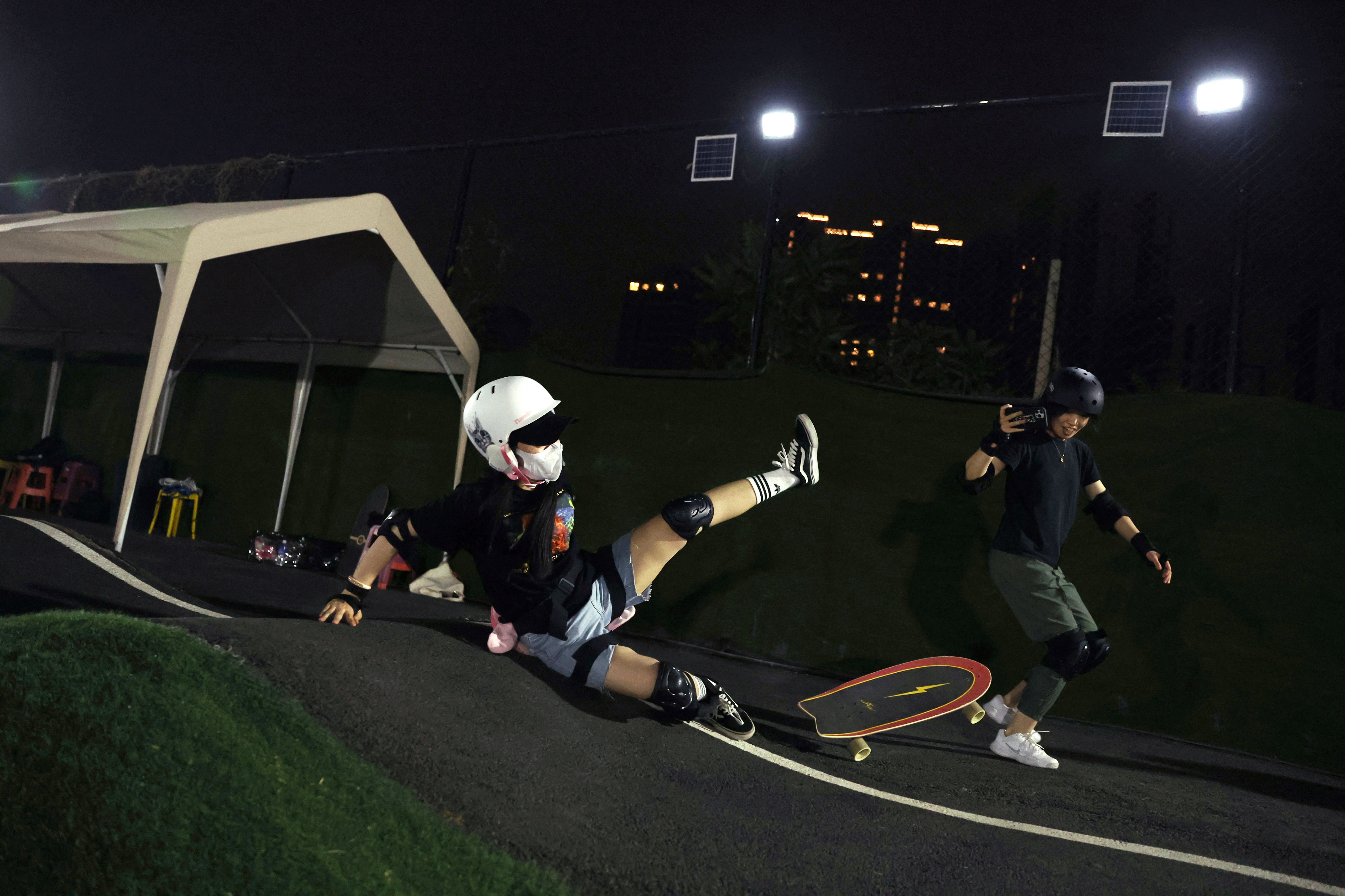 A boarder falls at a pump track in Beijing