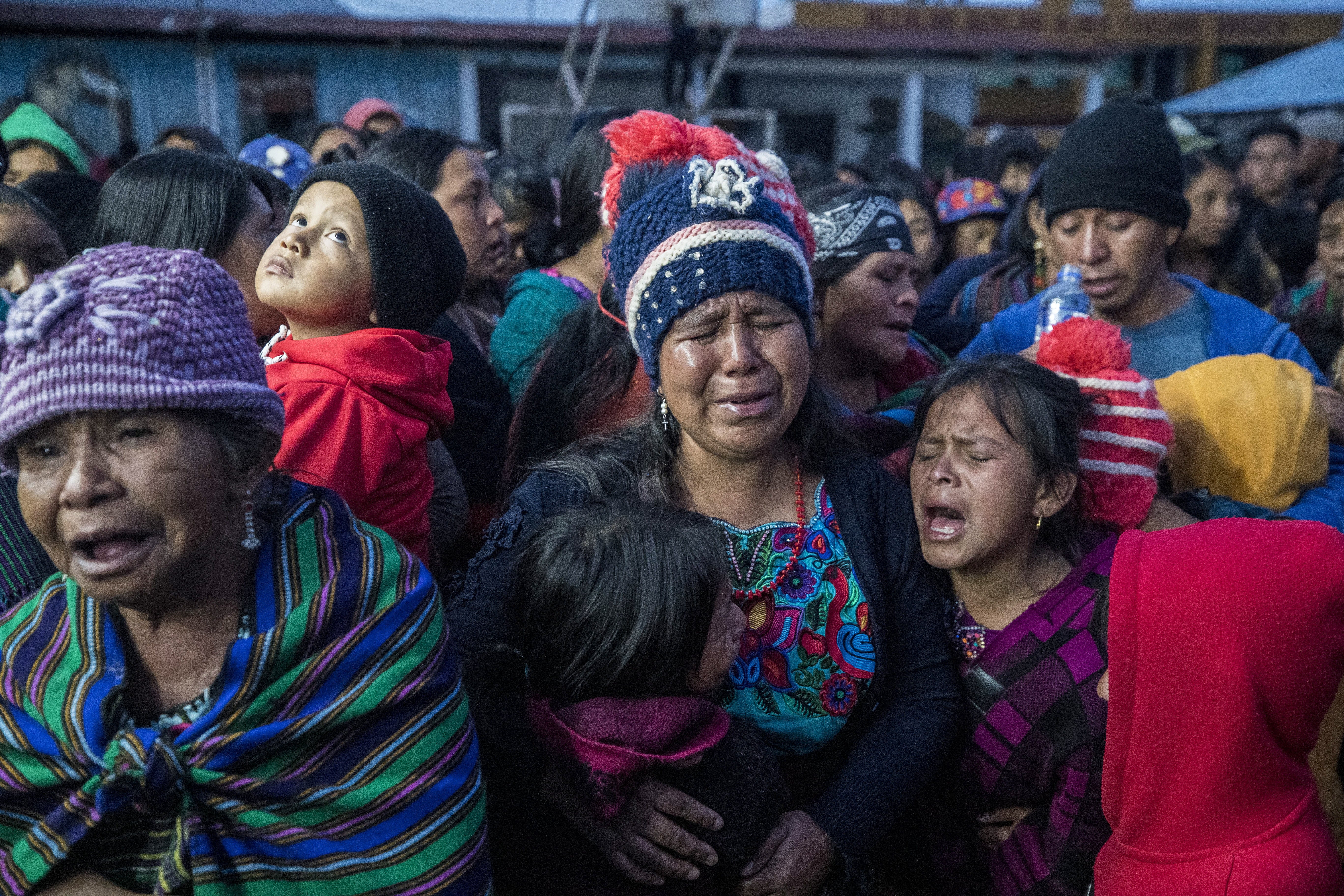 Relatives, friends and neighbors mourn while receiving the body of Pascual Melvin Guachiac Sipac, 13, who died in the tragedy of 27 June in Texas; in the Tzucubal village, Nahuala, Guatemala, 15 July 2022