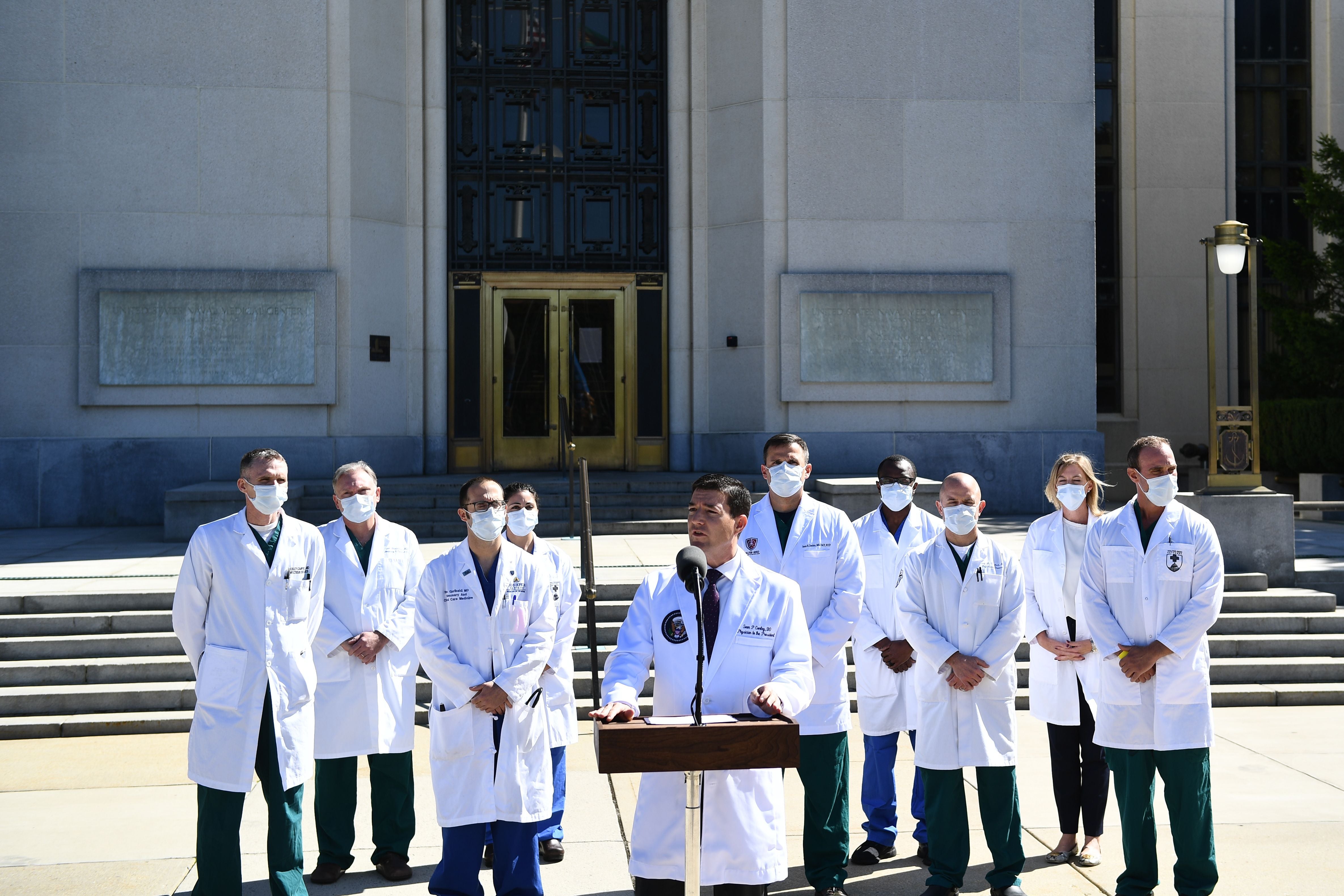 White House physician Sean Conley, with medical staff, gives an update on the condition of US President Donald Trump, on October 3, 2020, at Walter Reed Medical Center in Bethesda, Maryland