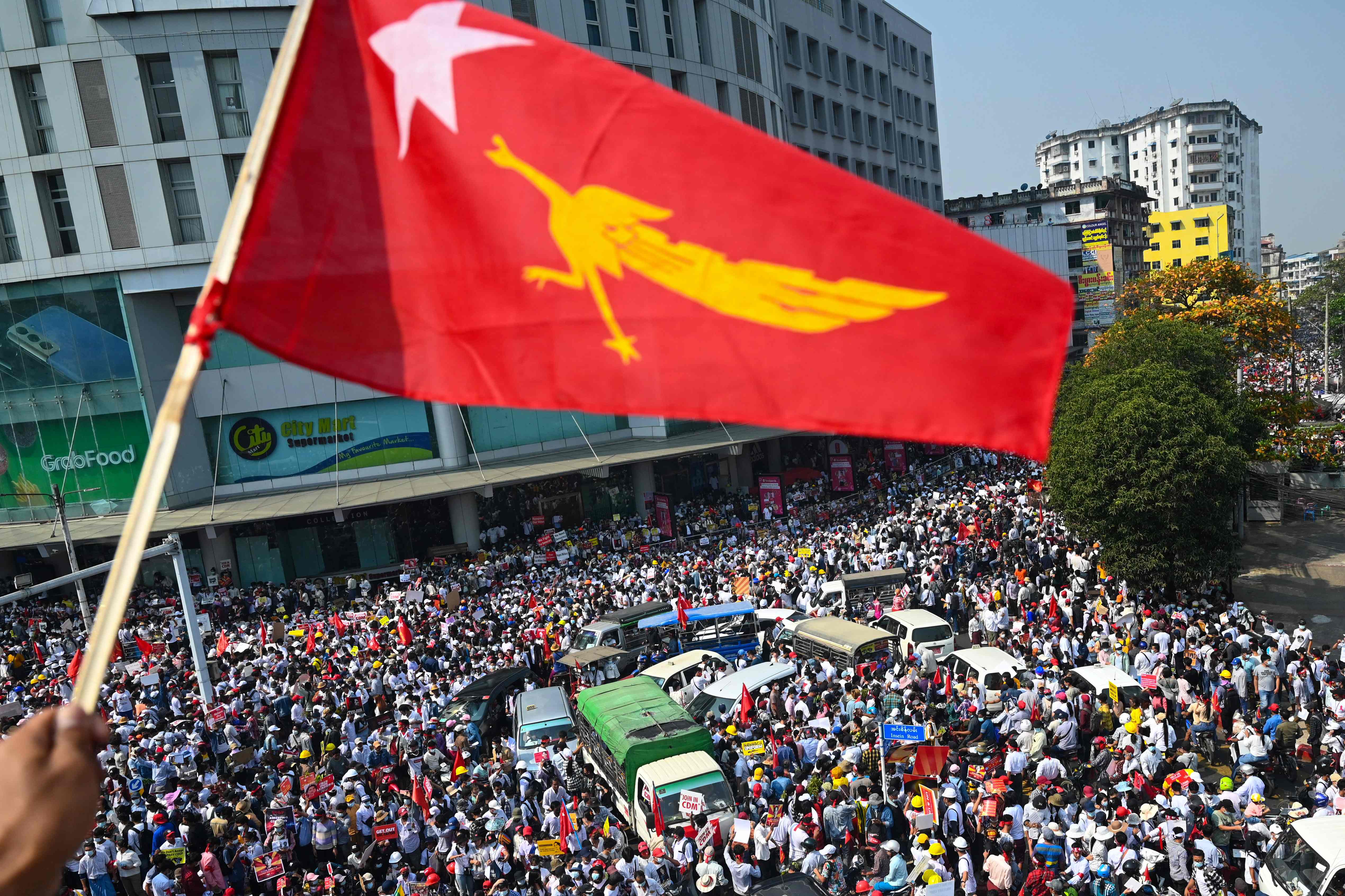 Protesters take part in a demonstration against the military coup in Yangon last year