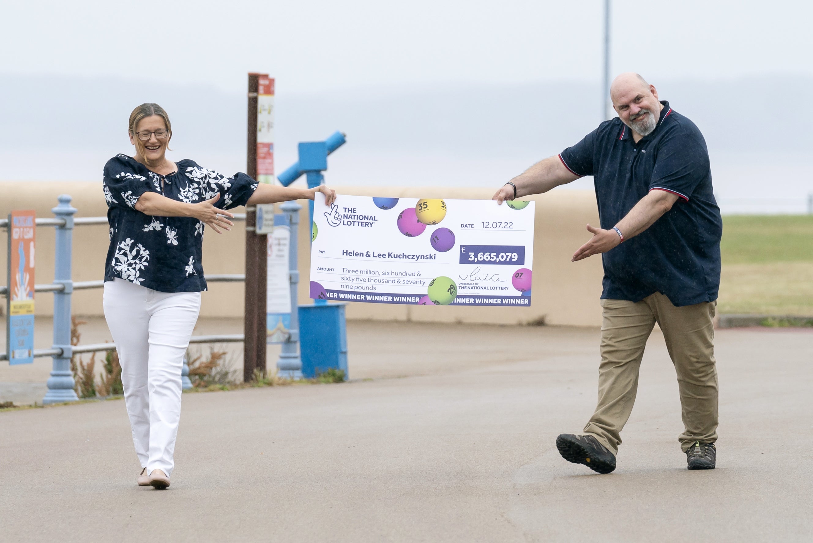 Helen and Lee Kuchczynski with their cheque (Danny Lawson/PA)