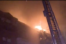 At least one person dead and 18 families displaced after huge blaze engulfs New Jersey apartment block