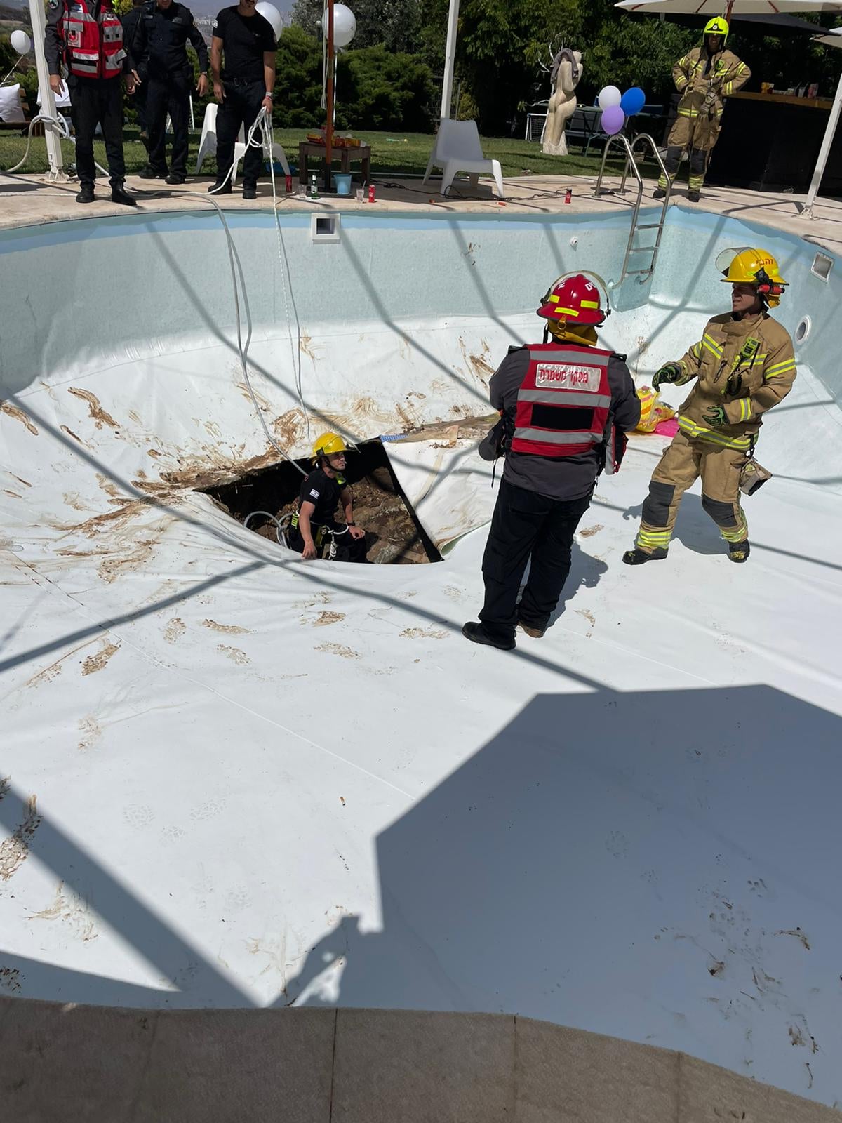 It took rescue workers four hours to retrieve the victim from the sink hole