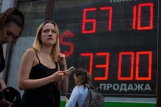 Russia's central bank slashes rate, saying inflation slows