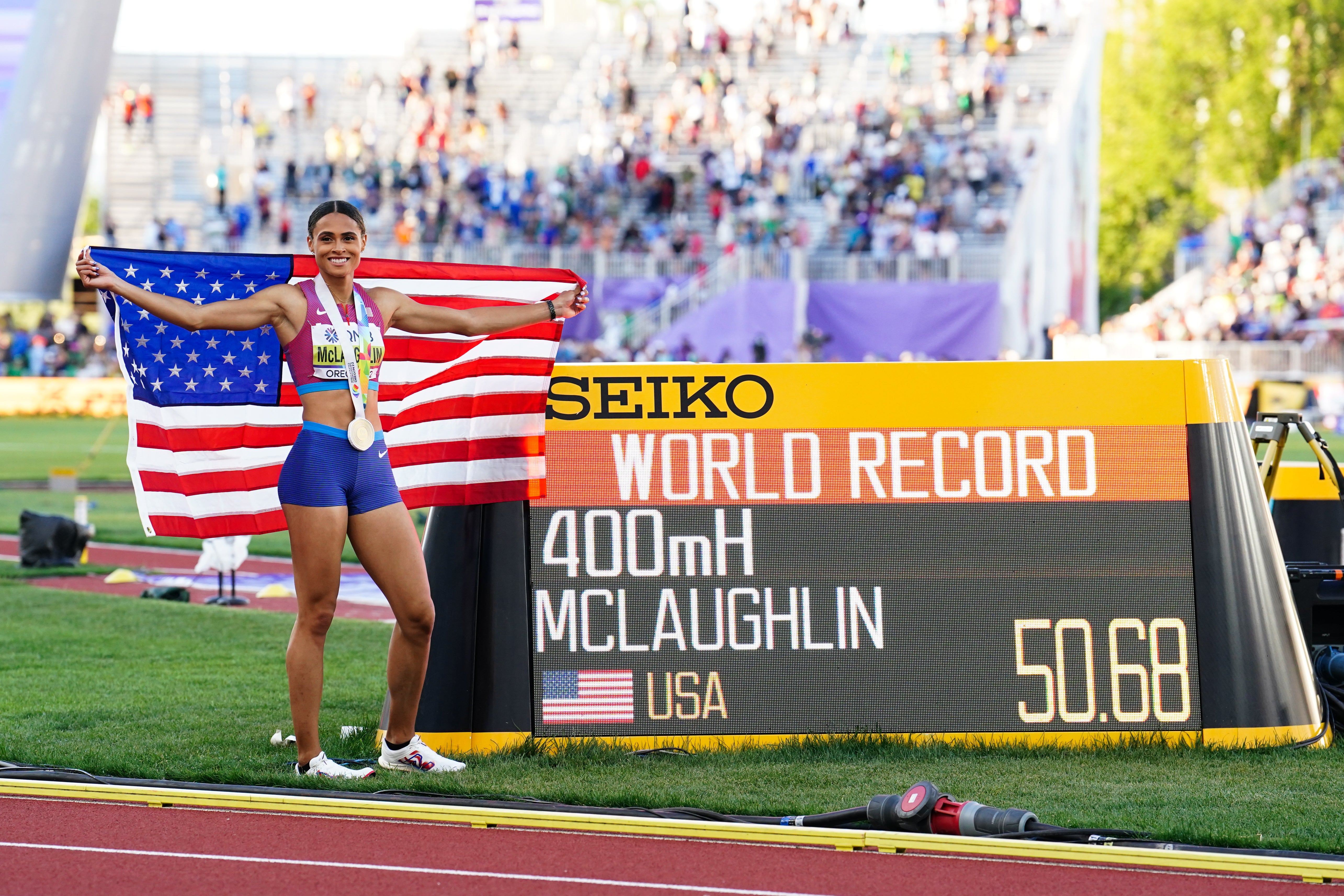 The USA’s Sydney McLaughlin celebrates gold and a new world record. (Martin Rickett/PA)