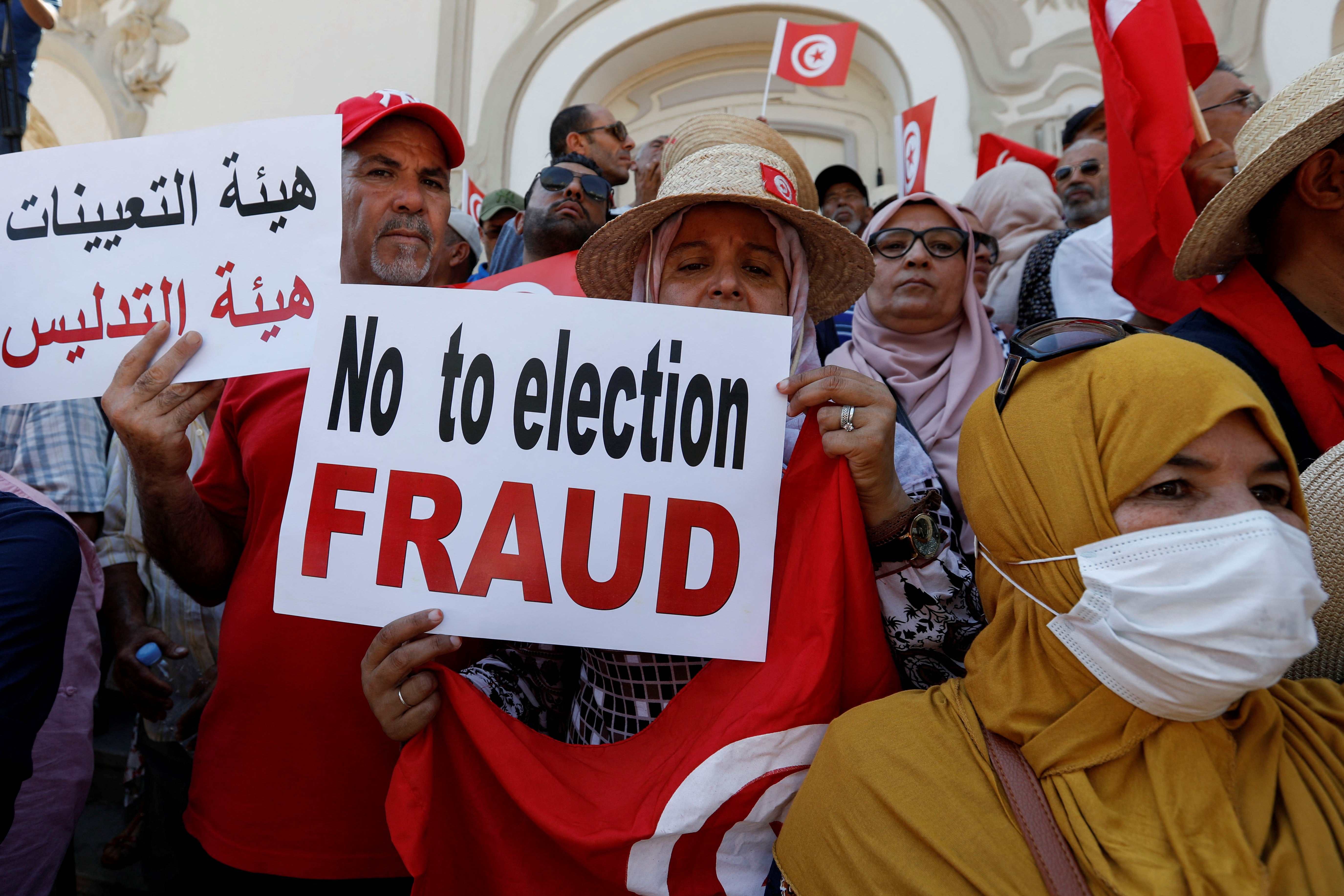 People take part in a protest against President Kais Saied’s referendum on a new constitution on Saturday