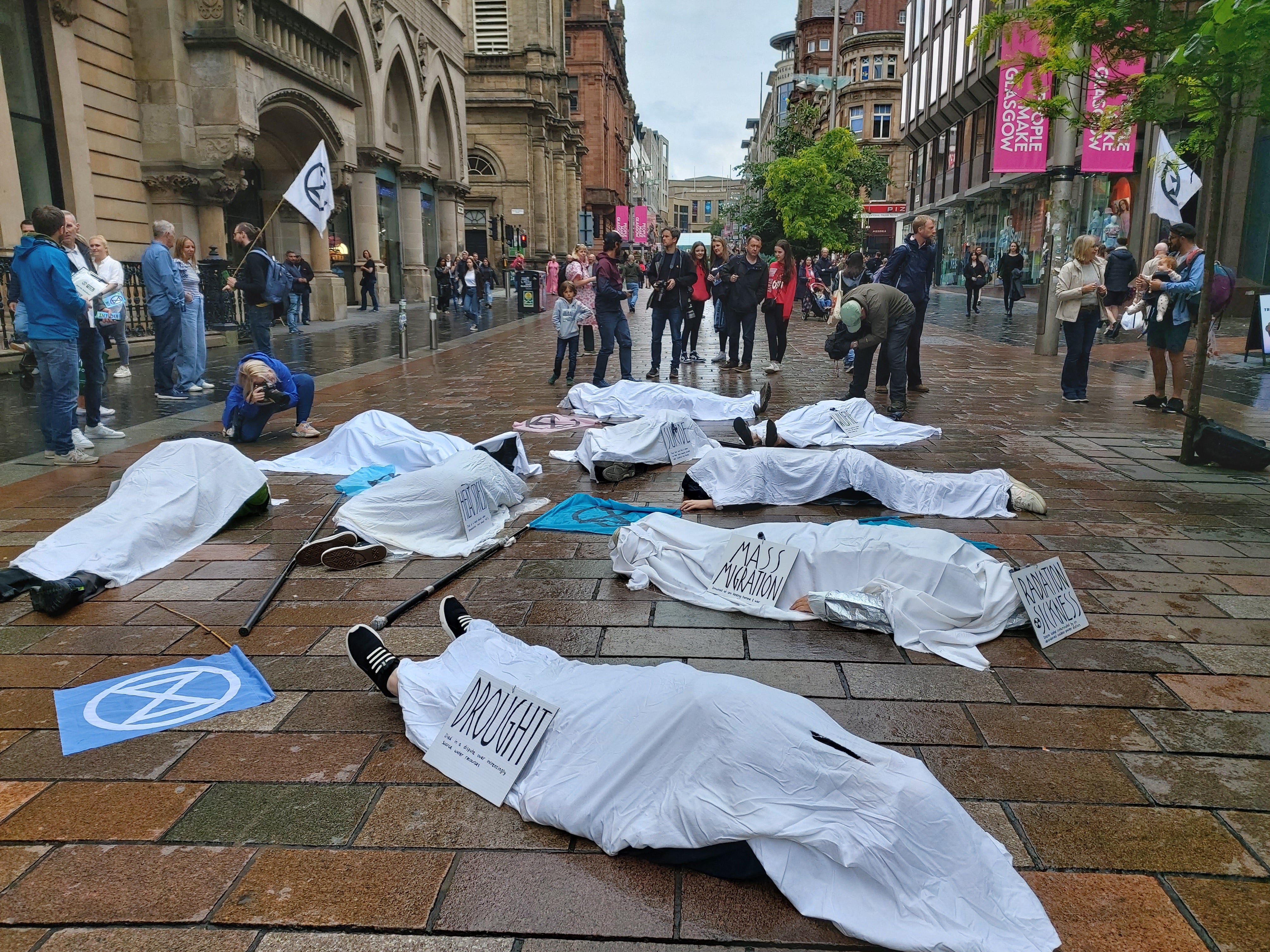 Extinction Rebellion protesters staged a ‘die in’ on Glasgow’s Buchanan Street following the heatwave. (Extinction Rebellion Scotland/PA)