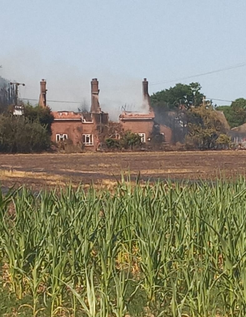 Smoke seen rising from the Calver’s house across a field