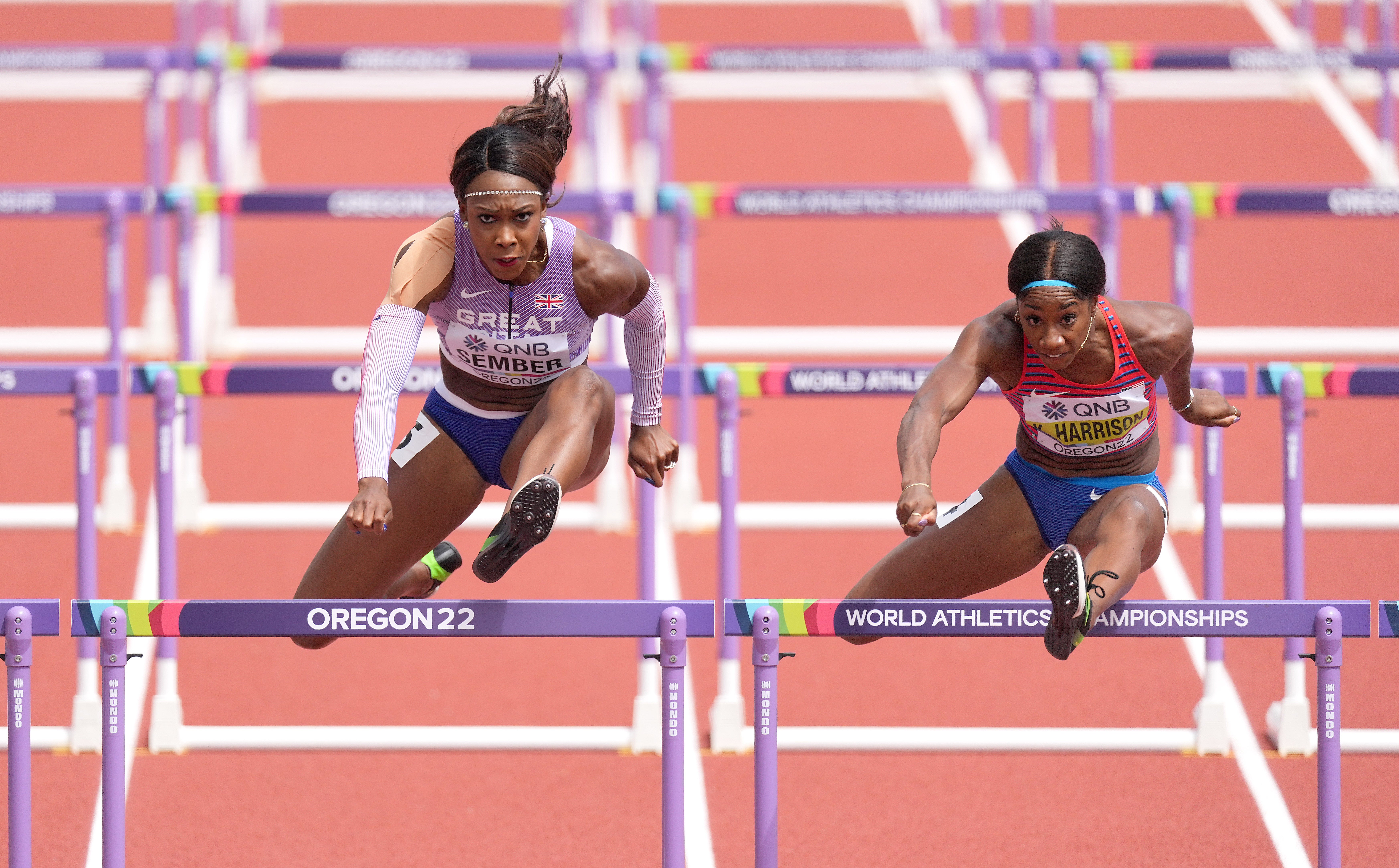 Great Britain’s Cindy Sember (left) with USA’s Kendra Harrison (right) in their heat. (Martin Rickett/PA)