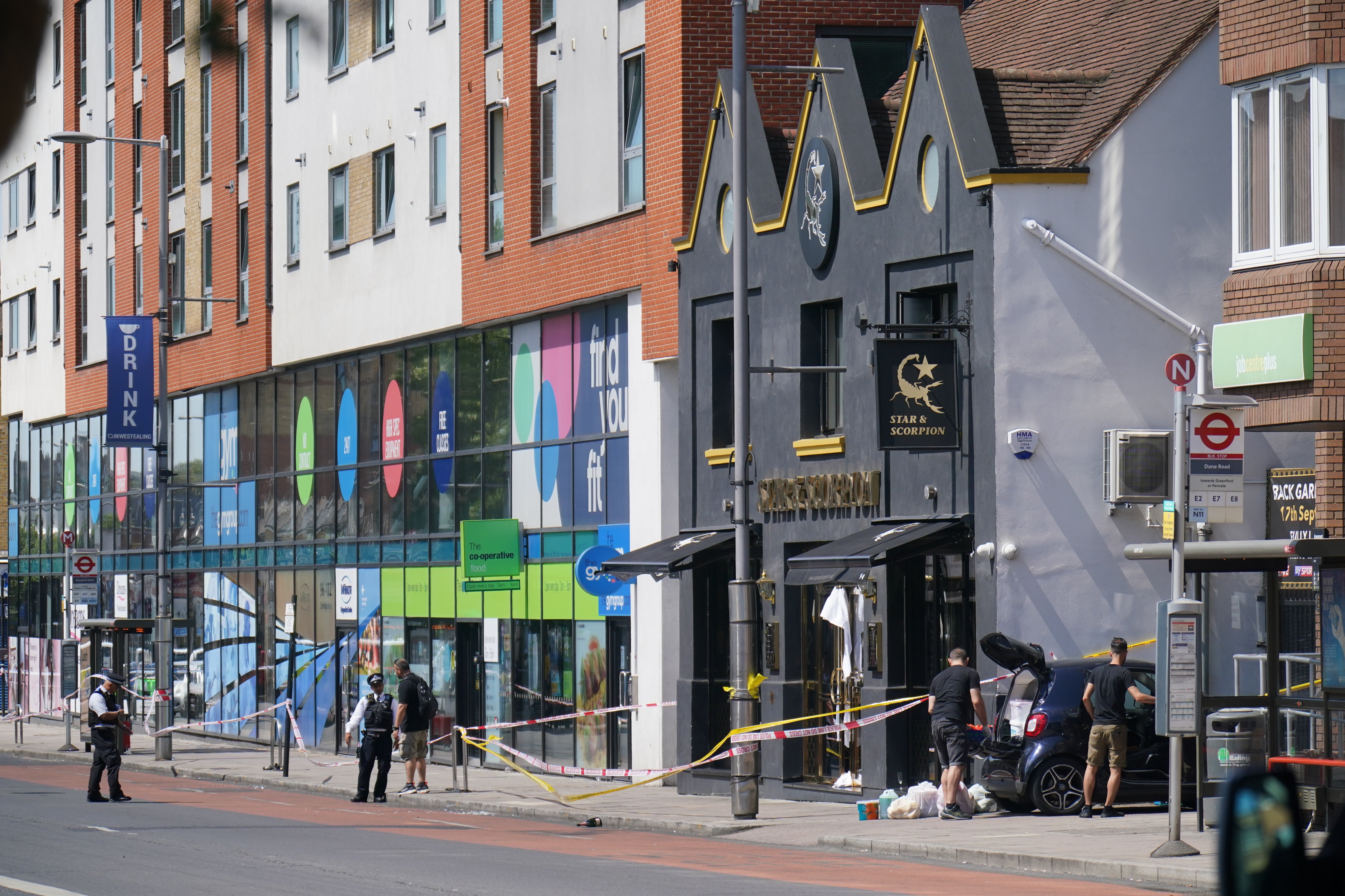 Police at the scene in Ealing in west London (Jonathan Brady/PA)