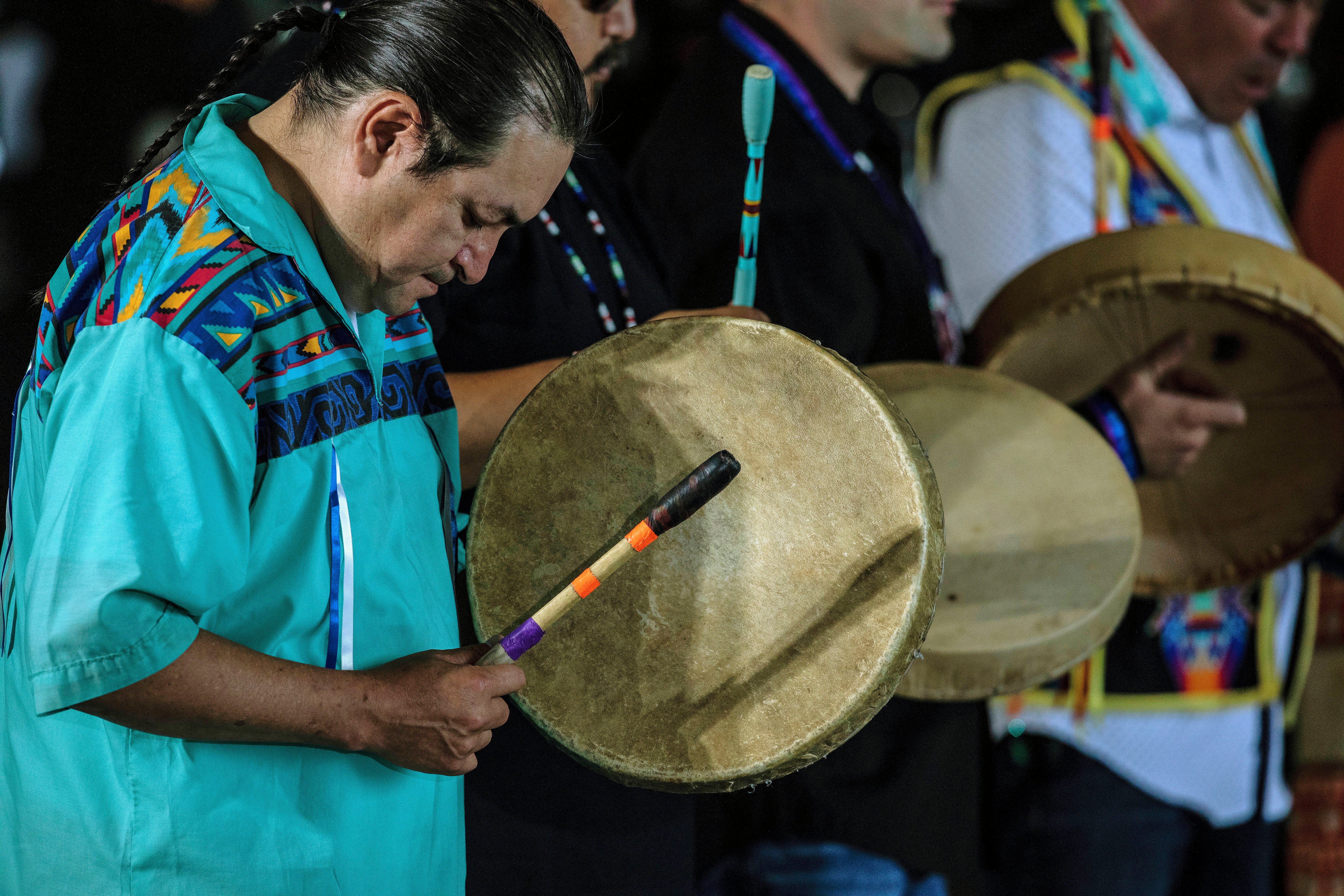 Indigenous drummers perform for Pope Francis as he arrives at the Edmonton International Airport