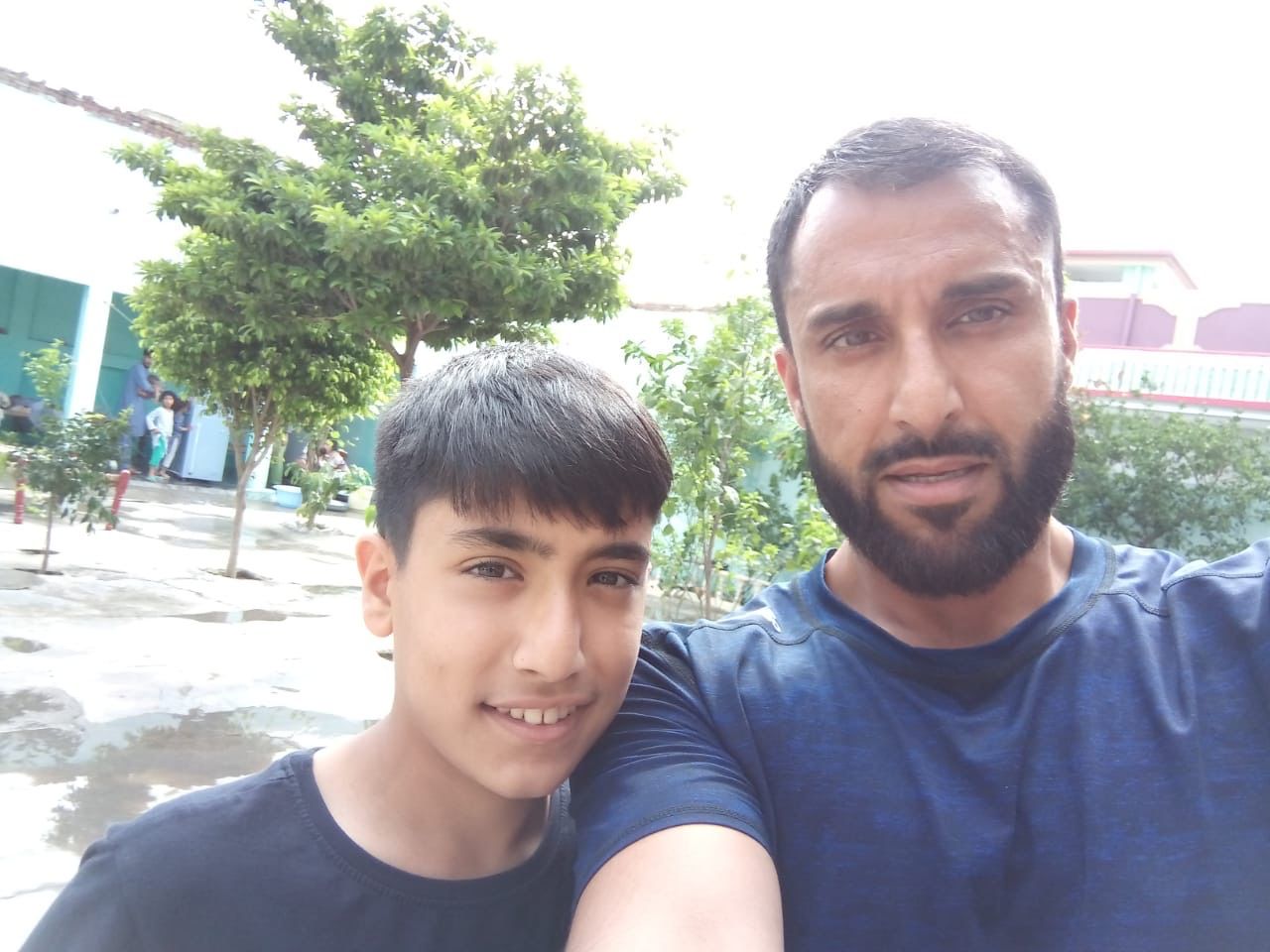 Sami Ahmed, who died in a fall in the Lake district on July 10, with his father Khalil (Family handout/PA)