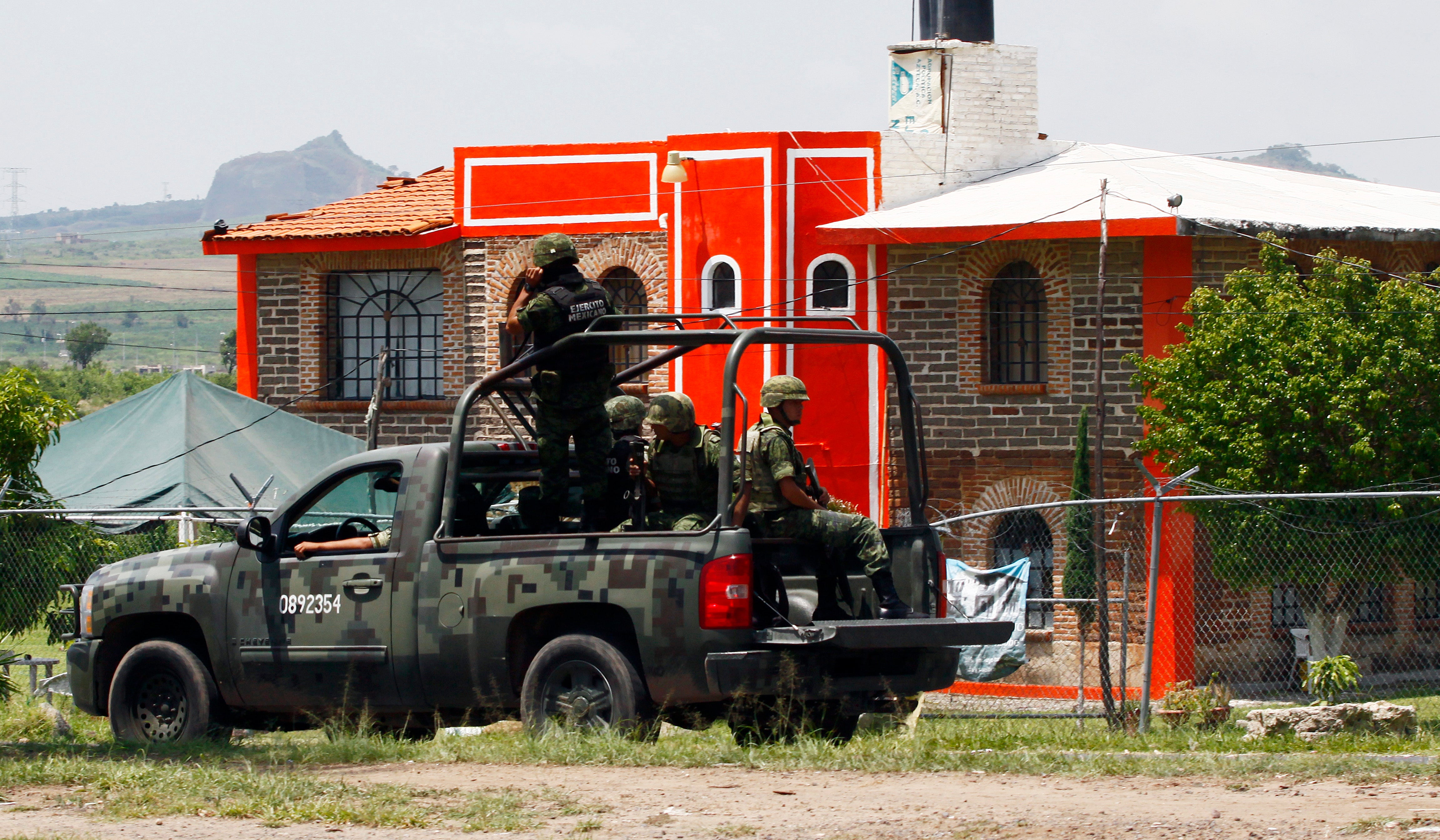 Members of the army patrol the surroundings of the Puente Grande State prison in Zapotlanejo from where Caro Quintero was released in 2013