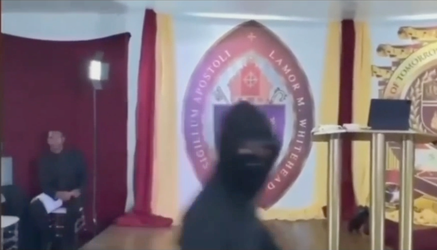 Gunman wearing a balaclava appears on live-streamed footage of the robbery at the Leader’s of Tomorrow International Ministry in Brooklyn