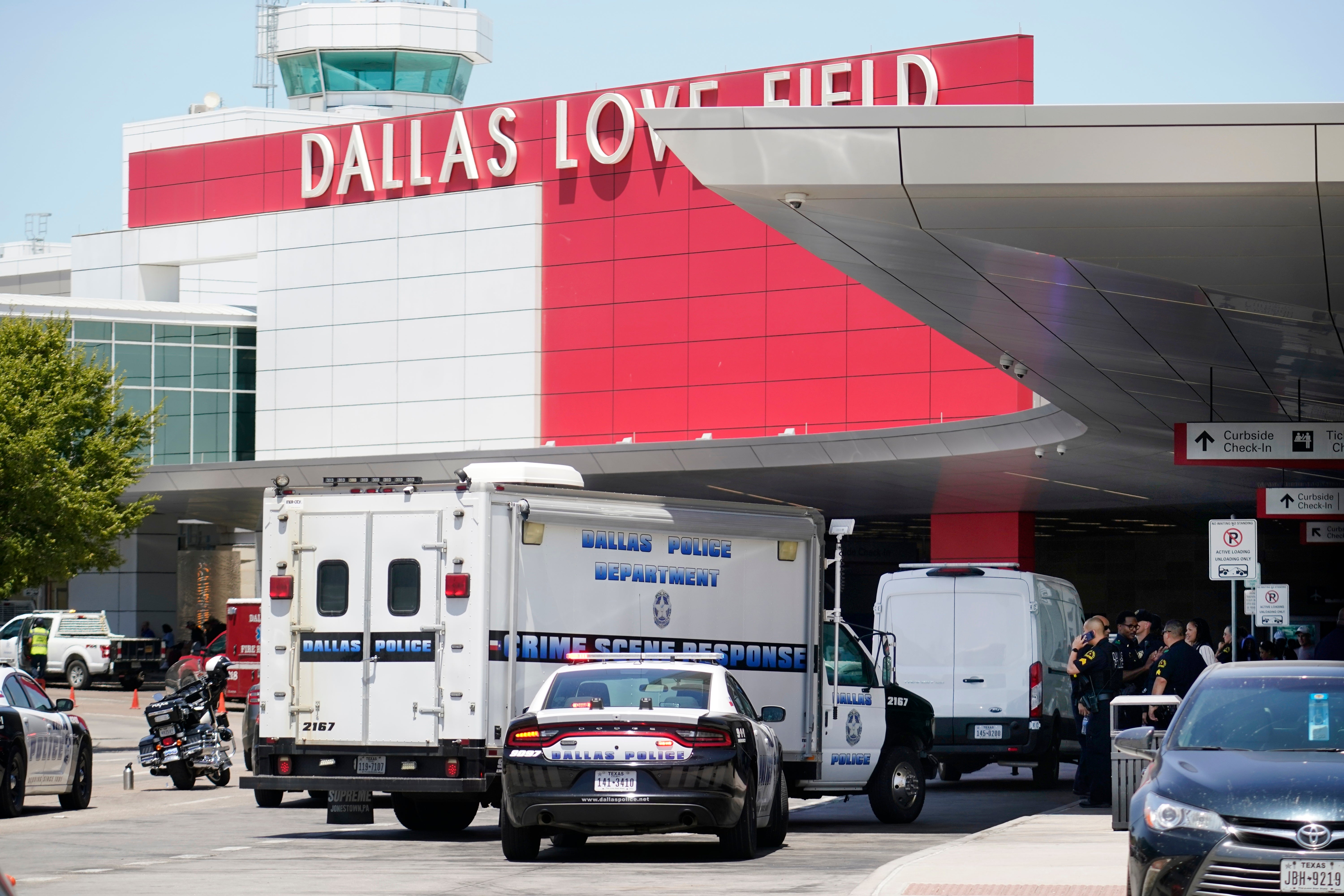 A crime scene response vehicle arrives at Dallas Love Field in Dallas, Monday, July 25, 2022