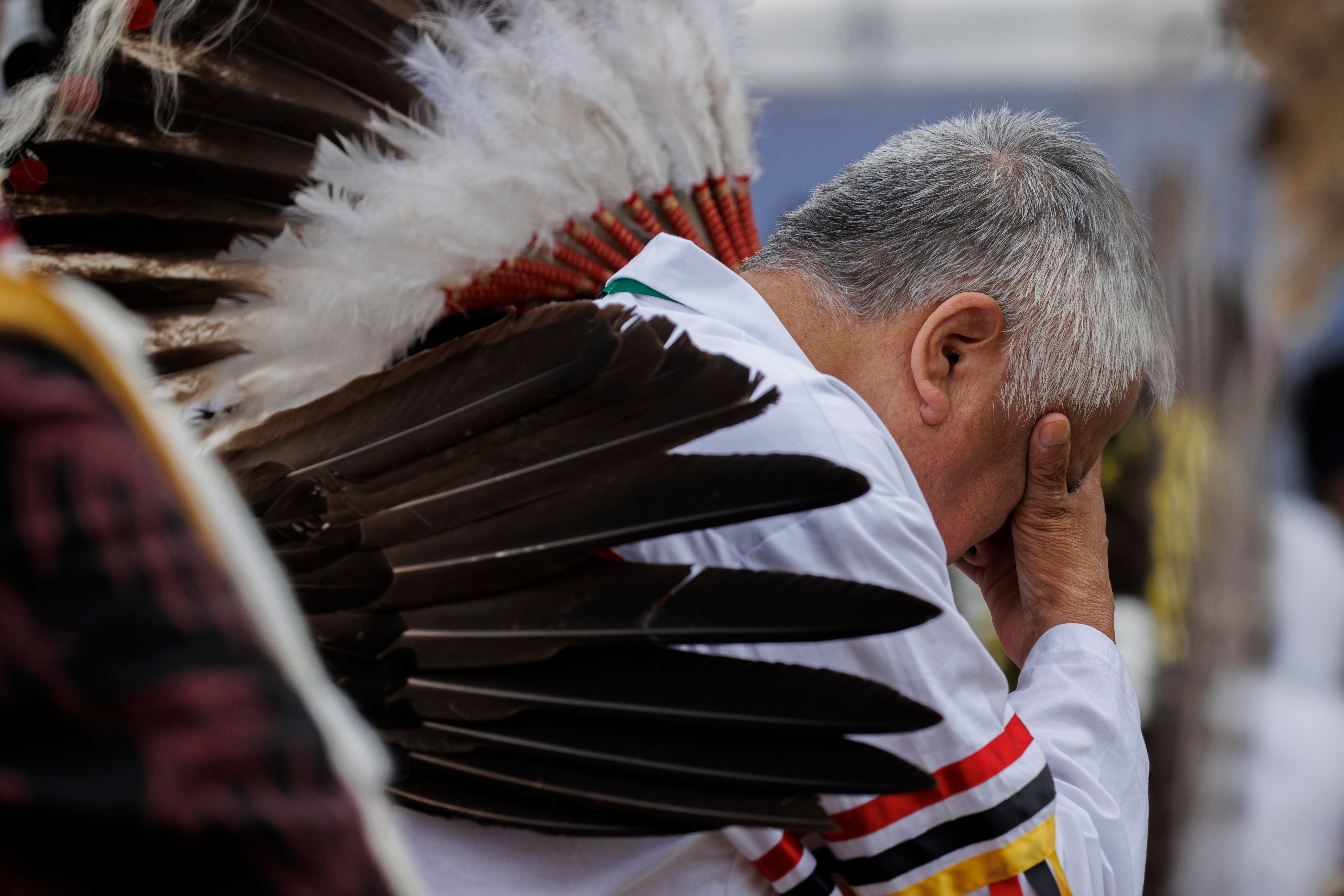 People react as Pope Francis issues an apology for the treatment of indigenous children in Canada's Residential School system on his visit to Maskwacis