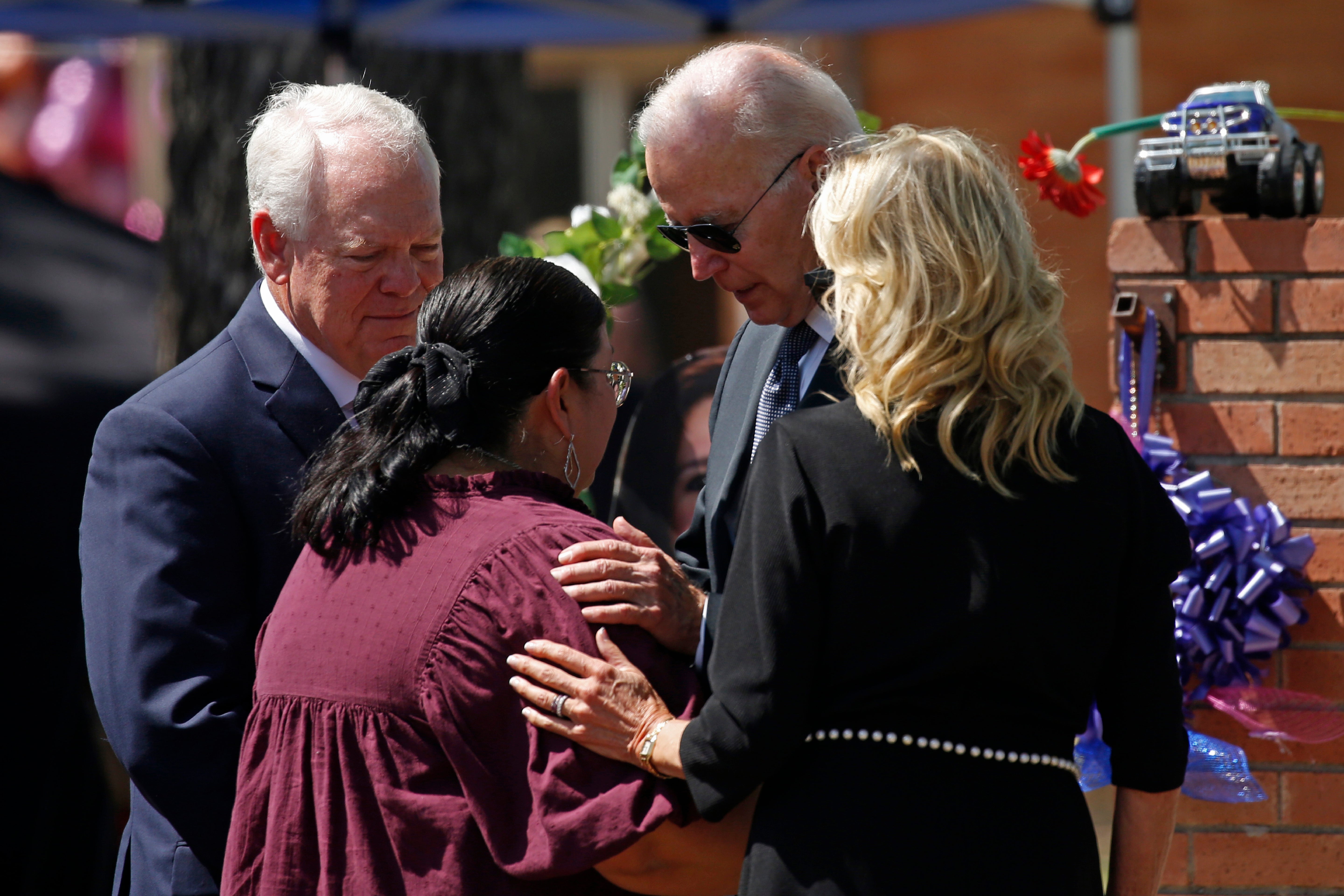 President Joe Biden comforts Robb Elementary School Principal Mandy Guttierez after massacre