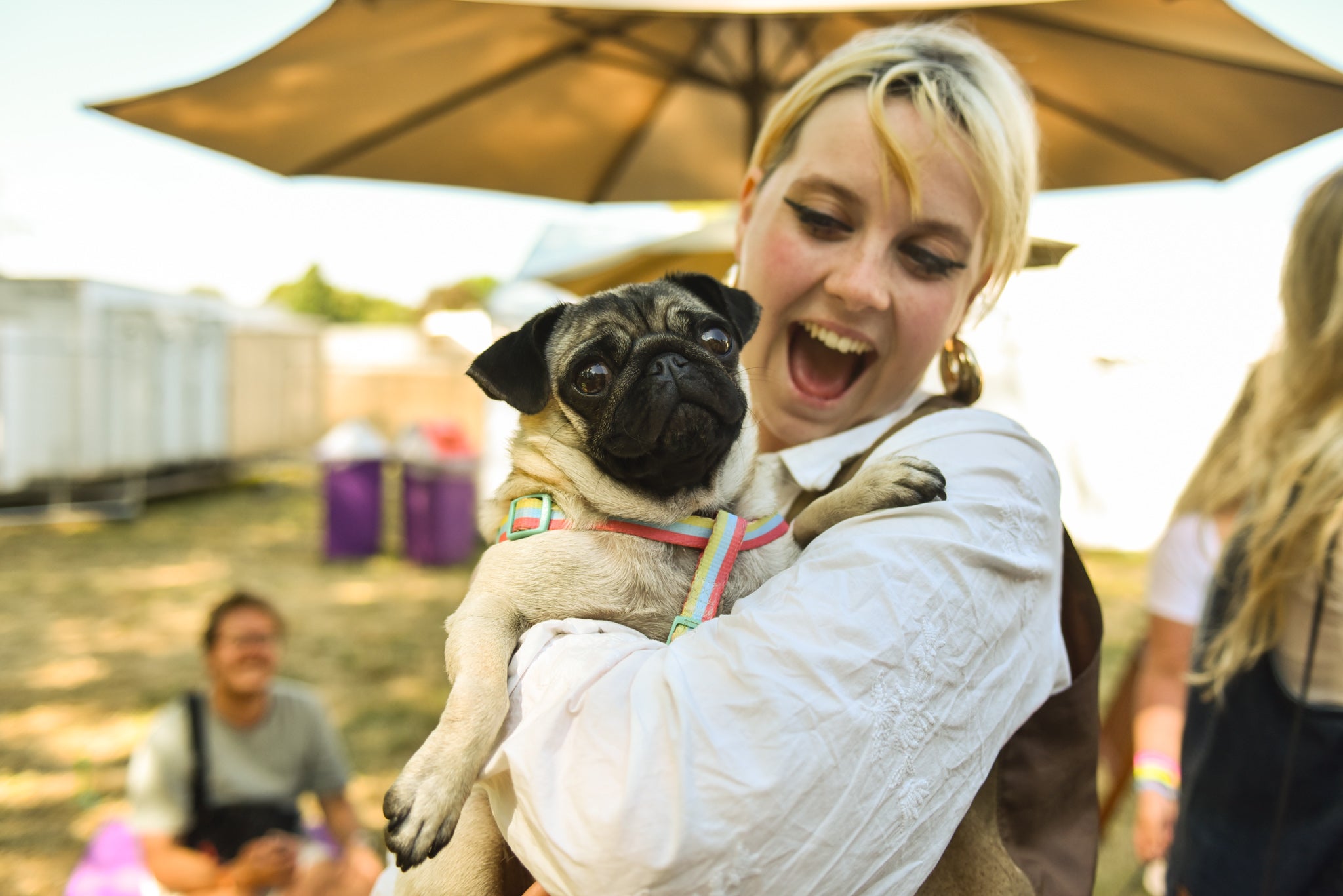 Chloe Howard of Lime Garden cuddling a pug