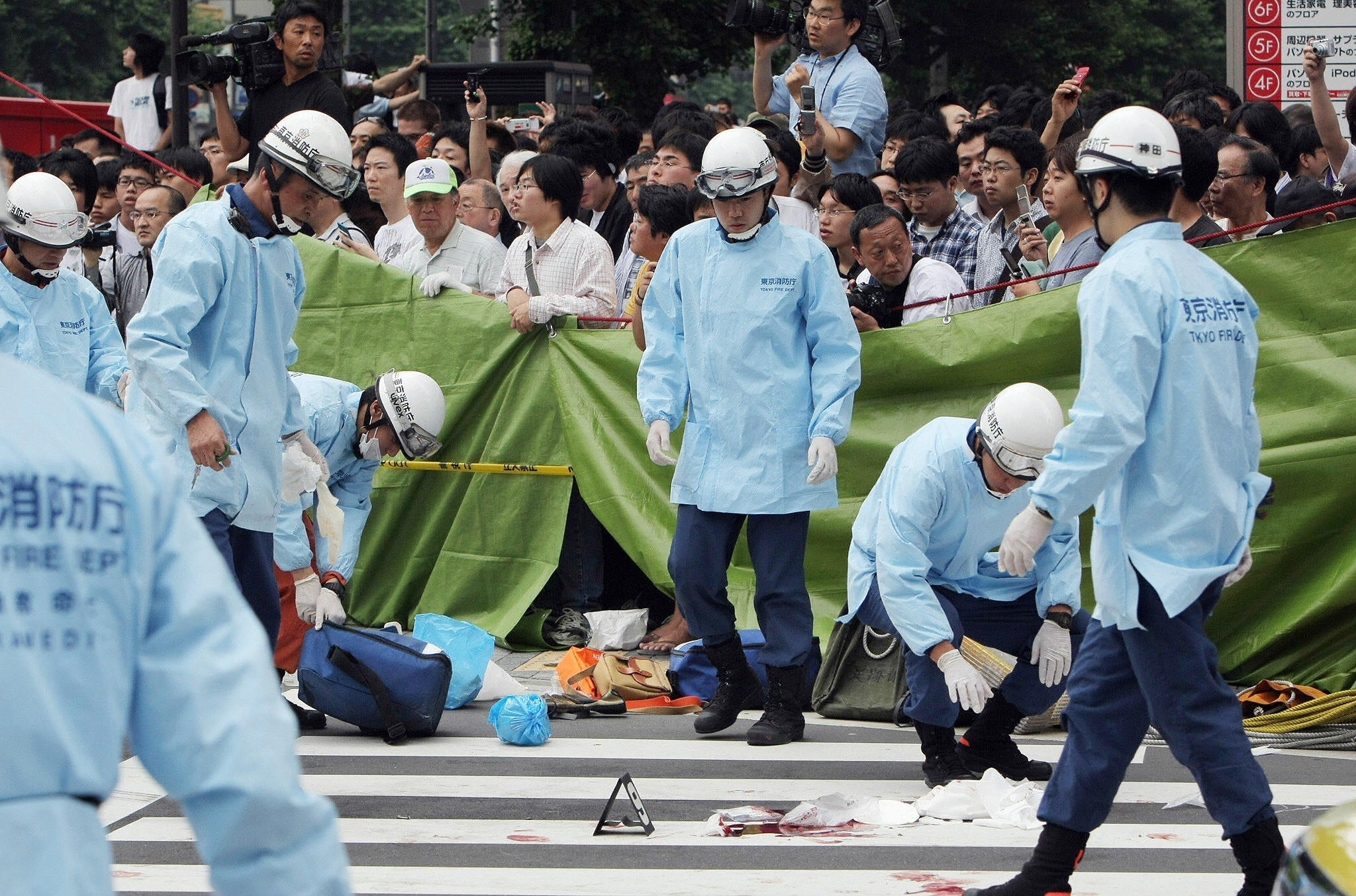 Emergency responders at the site of Kato’s killing spree