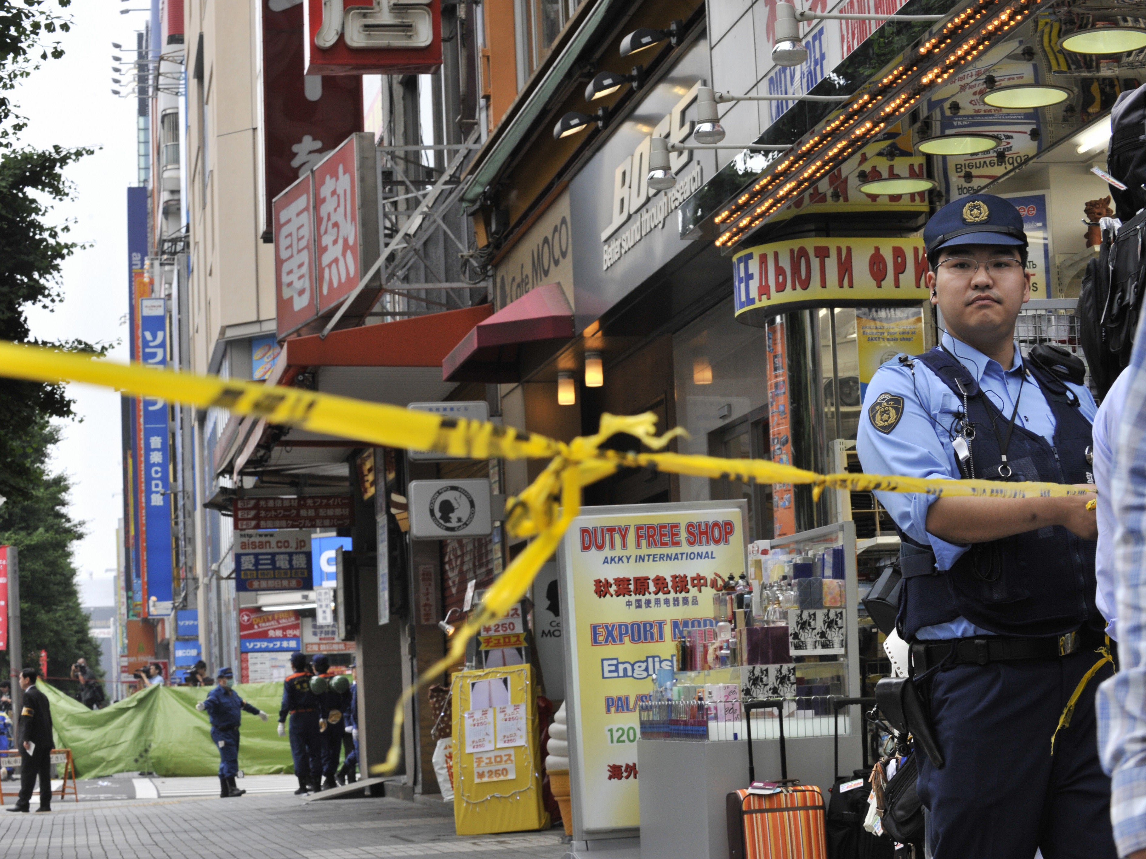 Police at the scene of a mass murder in Tokyo in 2008 which has now seen perpetrator Tomohiro Kato put to death