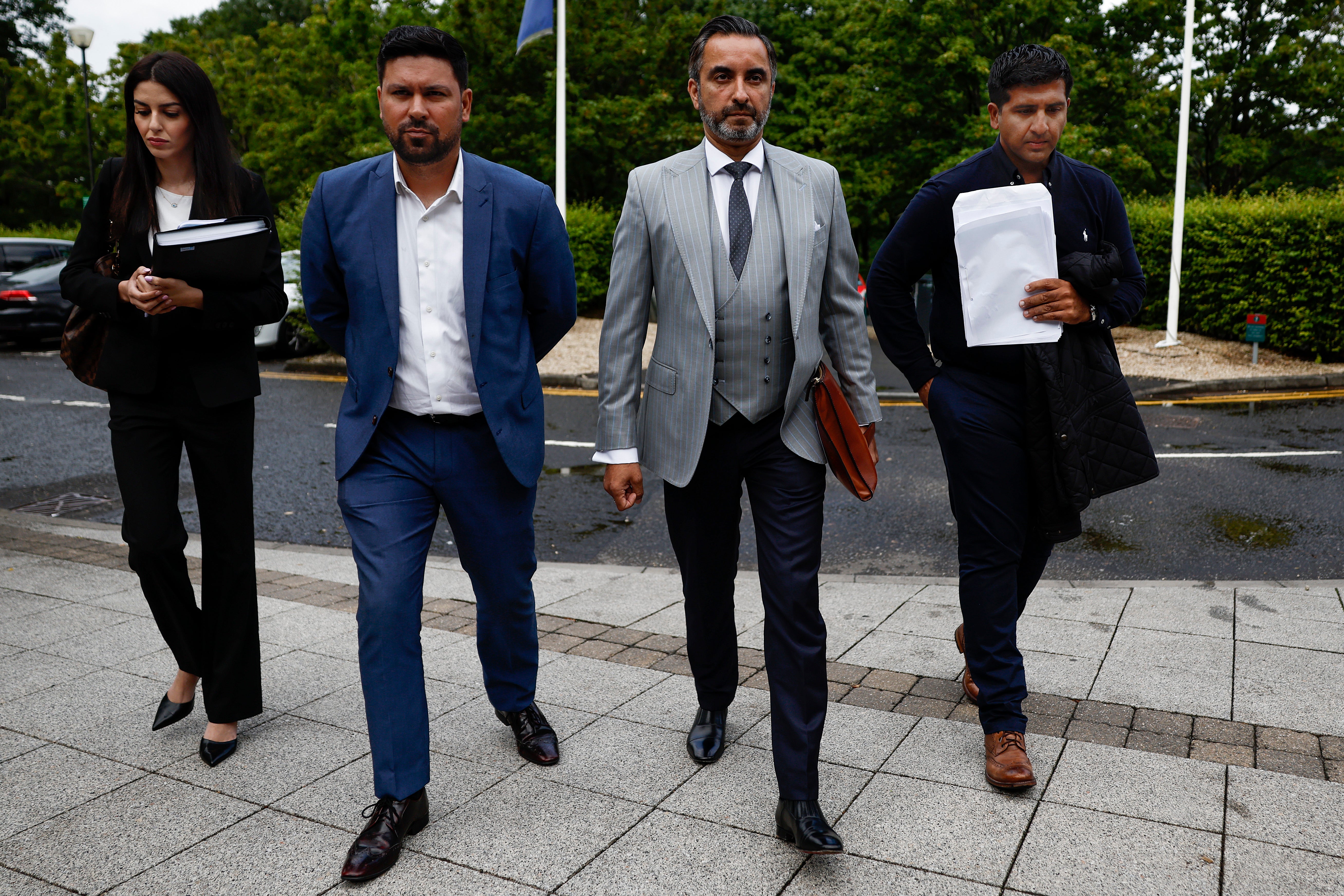 Cricketers Majid Haq and Qasim Sheikh arrive with lawyer Aamer Anwar