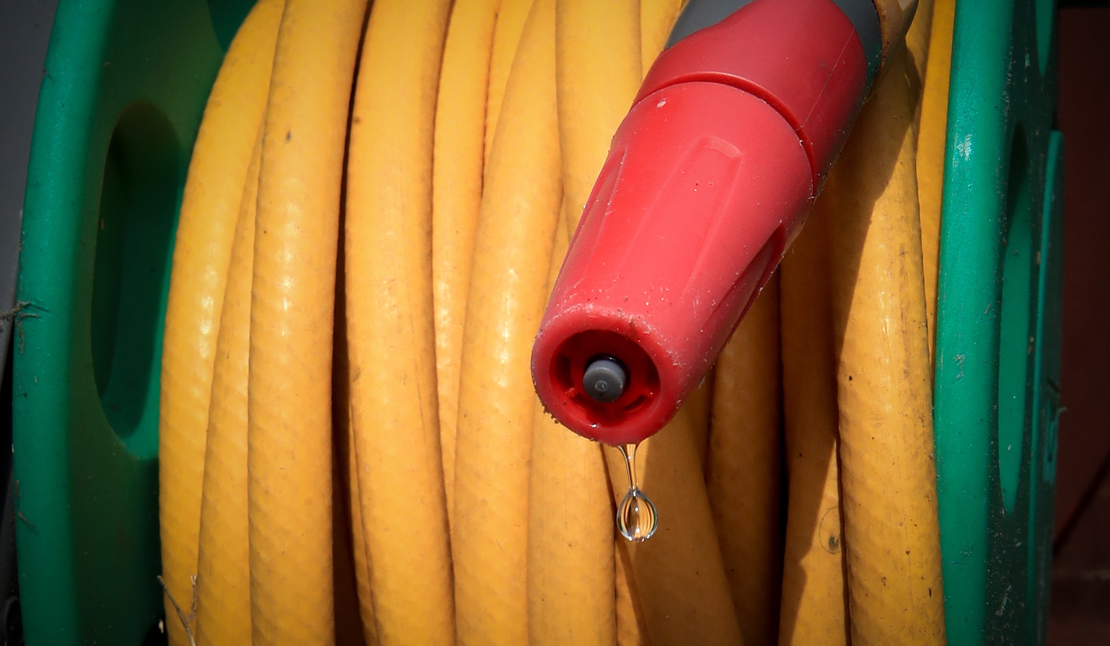 Hosepipe attached to a water tap. The North West Region of England is to be hit with a hosepipe ban next month due to the recent heatwave the highest on record for the time of year.