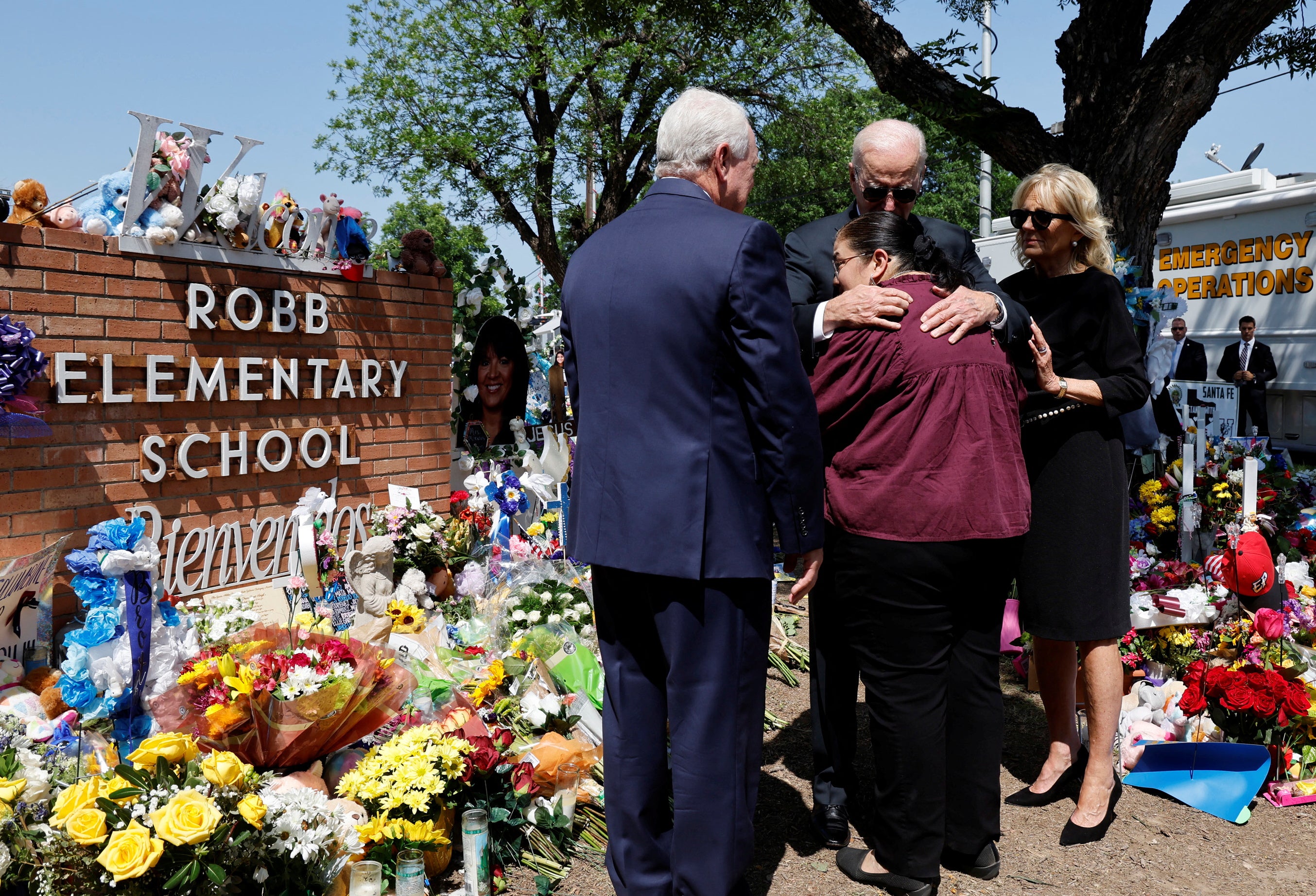 President Joe Biden hugs Mandy Gutierrez, Principal at Robb Elementary School, at the site of the massacre on 29 May