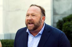 Alex Jones shakes his head as Sandy Hook shooting lies read out in court