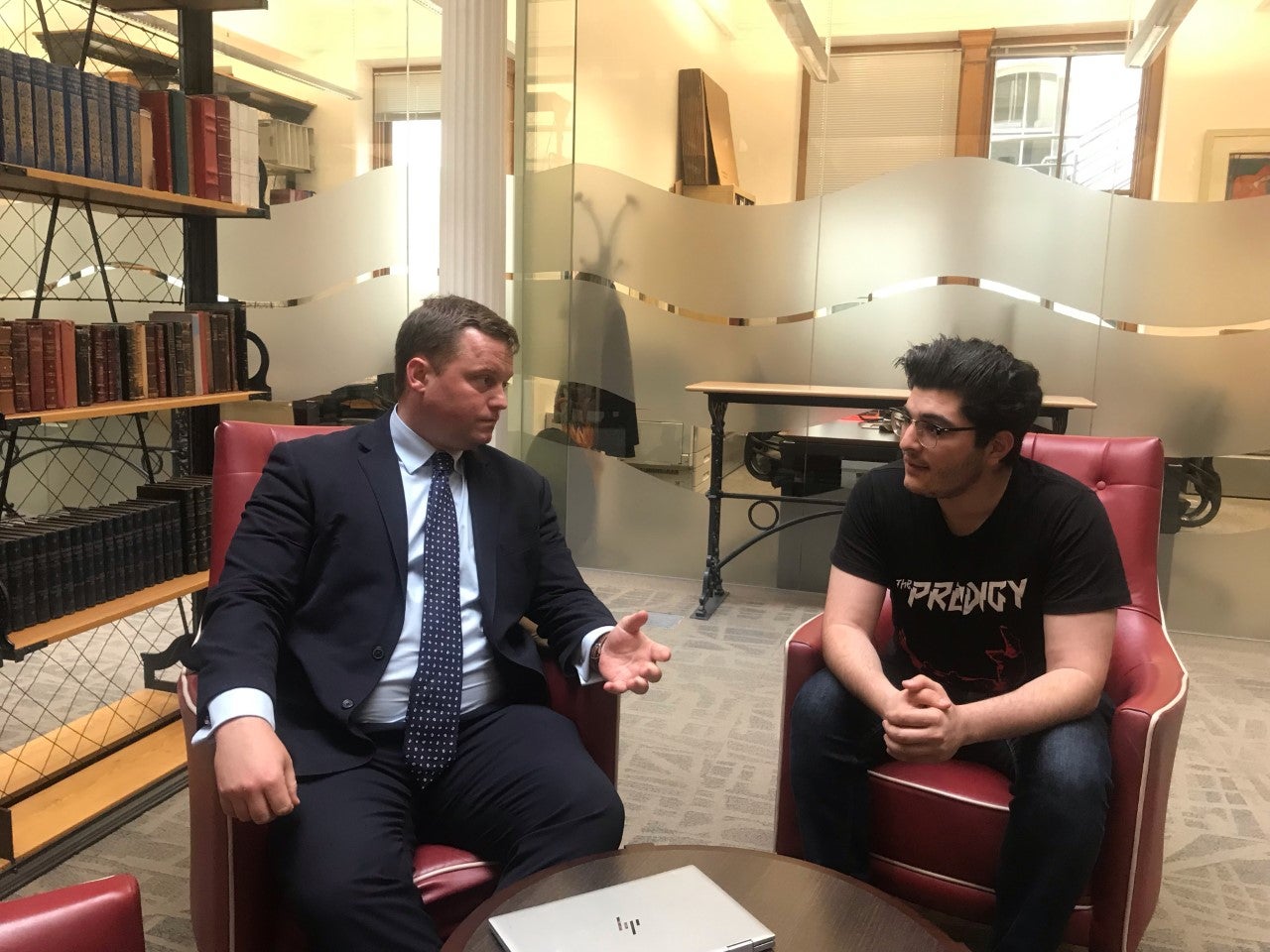 Human rights barrister Michael Polak in conversation with his client, activist Drew Pavlou