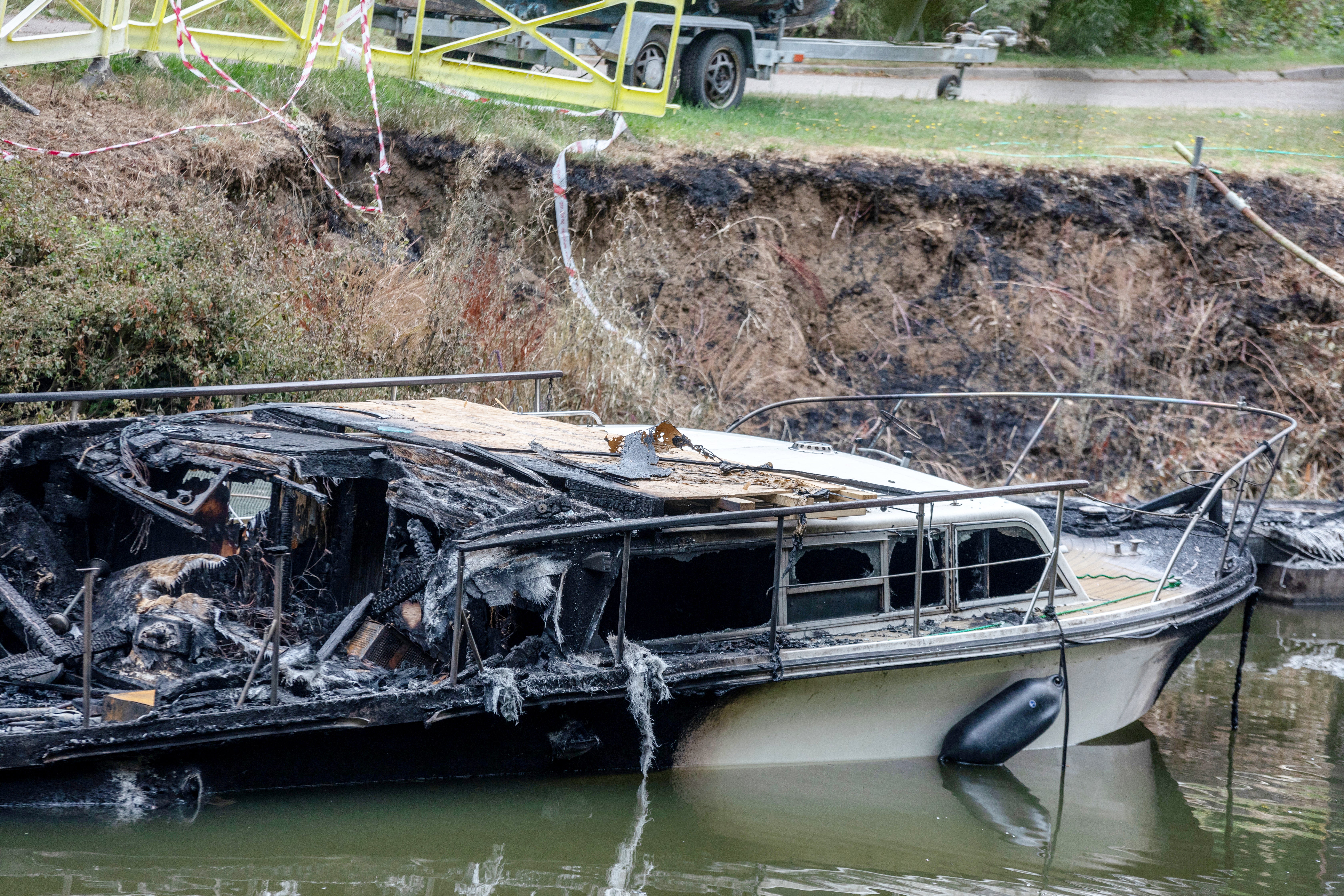 Several residents, including an off-duty firefighter, rushed out with buckets of water but some vessels were left completely gutted