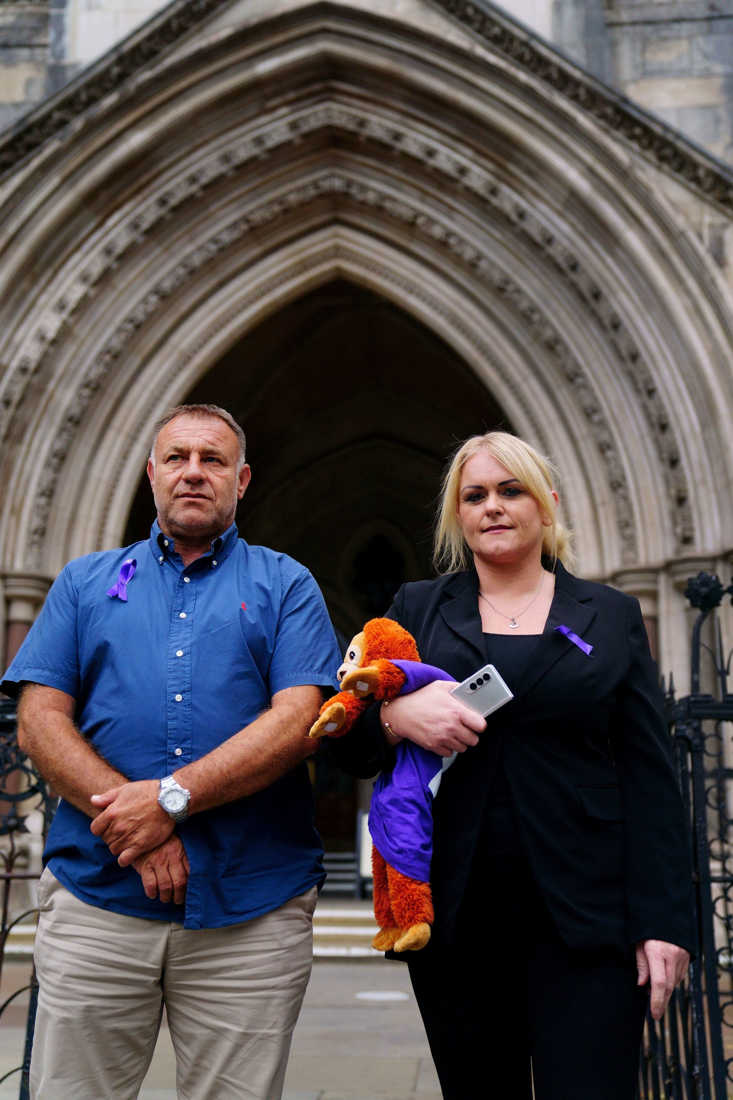 The parents of Archie Battersbee, Paul Battersbee and Hollie Dance, standing outside the Royal Courts Of Justice in London