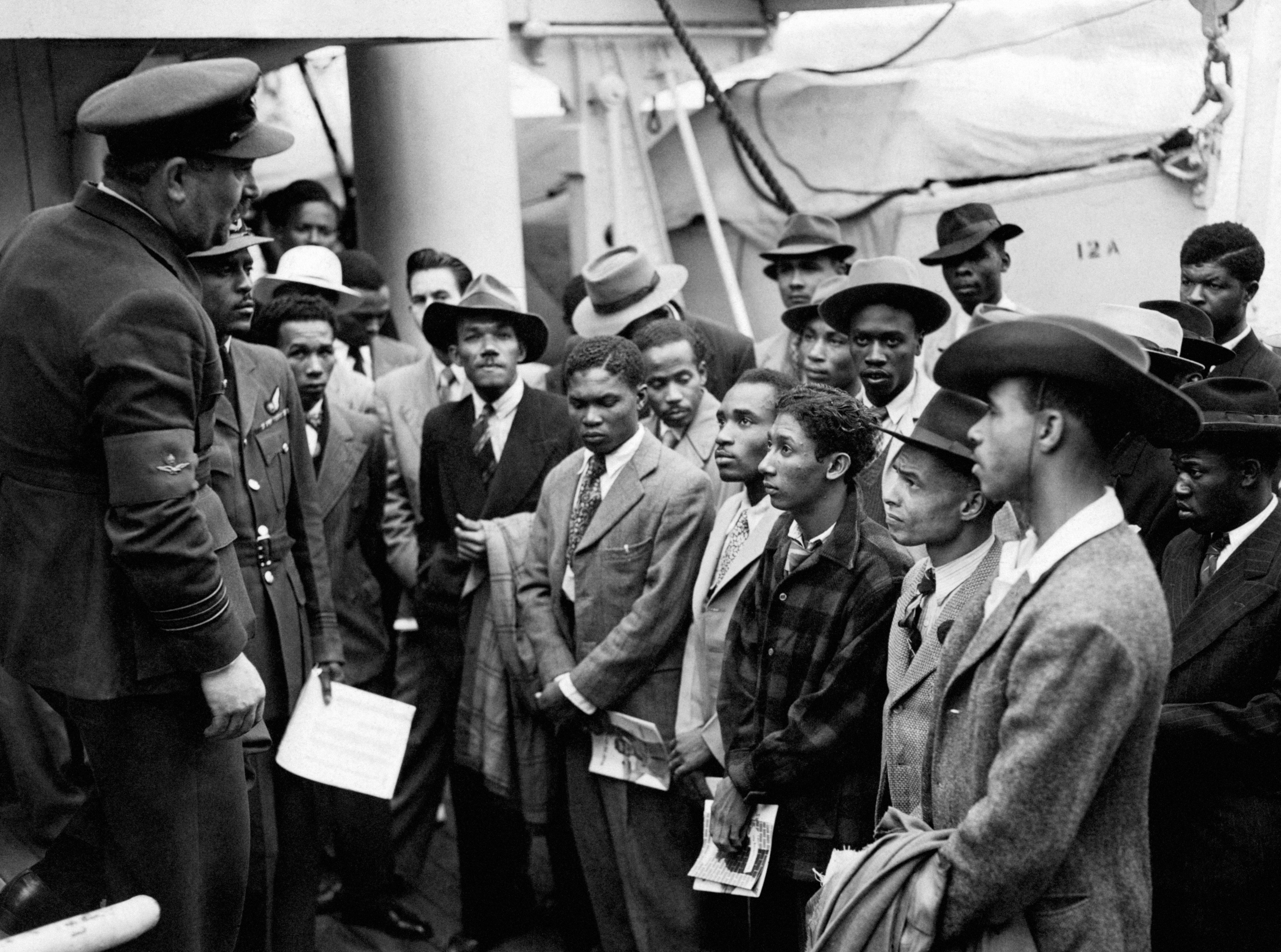 Jamaican immigrants are welcomed by RAF officials after ‘Empire Windrush’ landed them at Tilbury