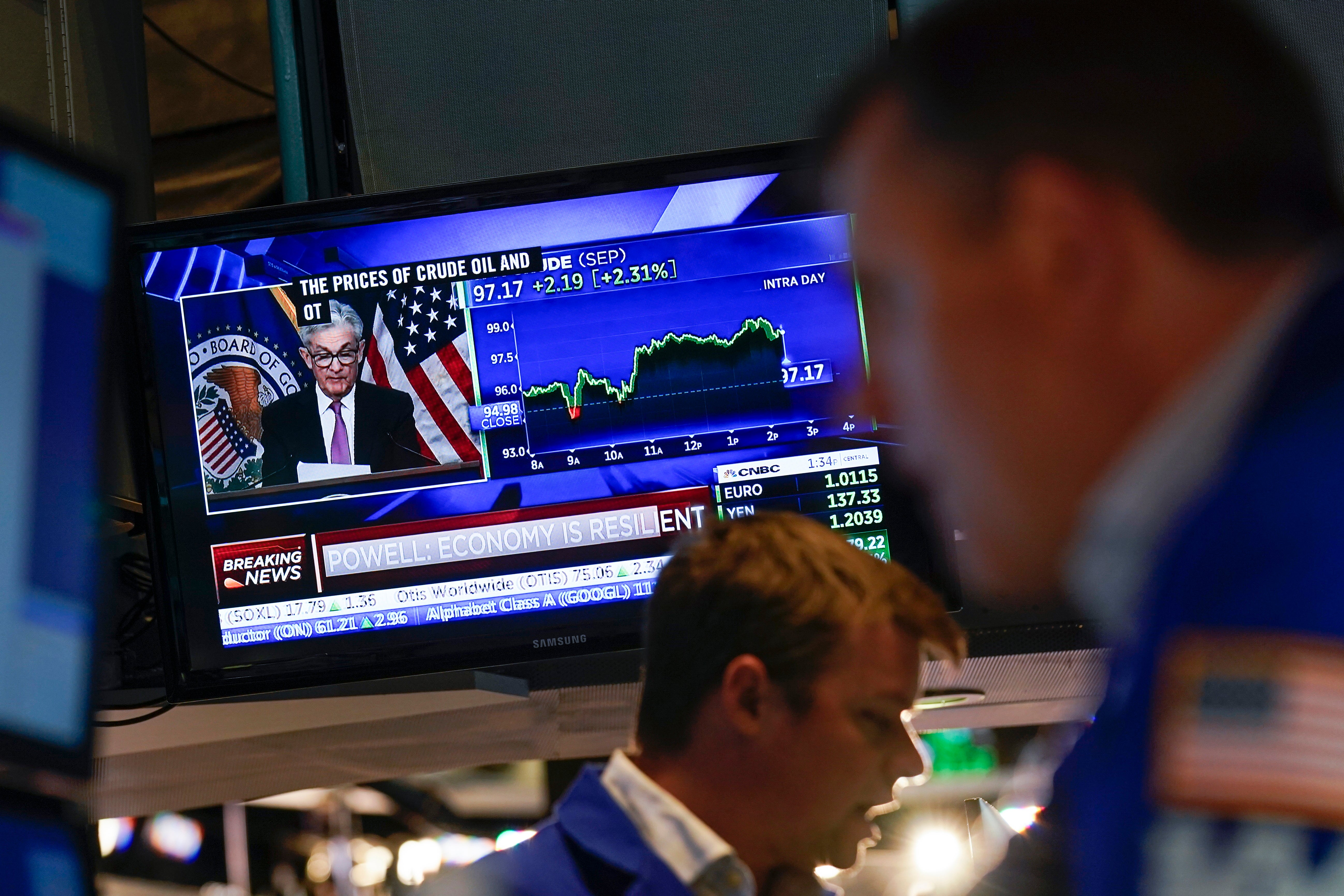 As traders work and watch, a news conference held by Federal Reserve Chair Jerome Powell is displayed at the New York Stock Exchange in New York (Seth Wenig/PA)