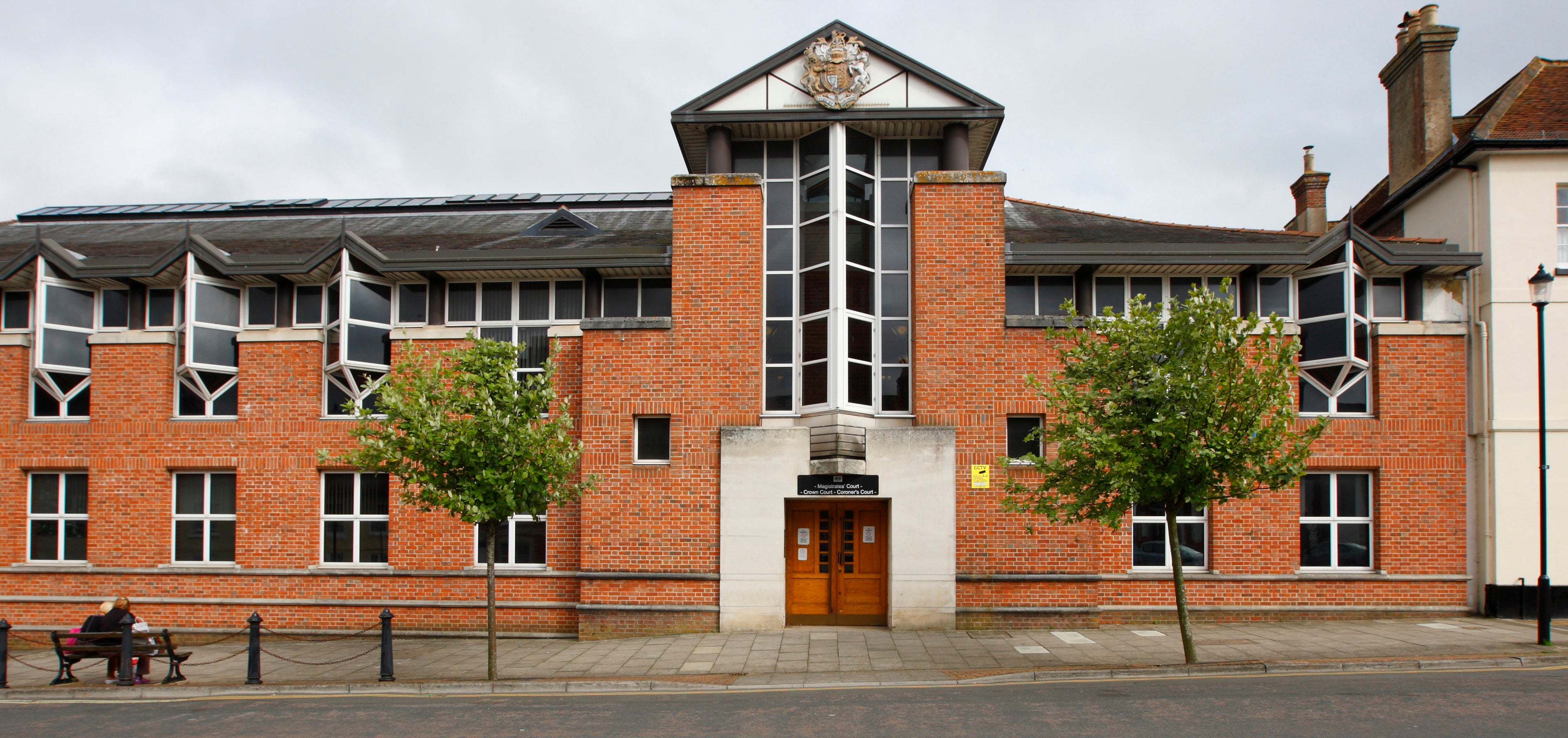 Two men and a woman are now on trial at Newport Crown Court charged with modern slavery offences (PA)