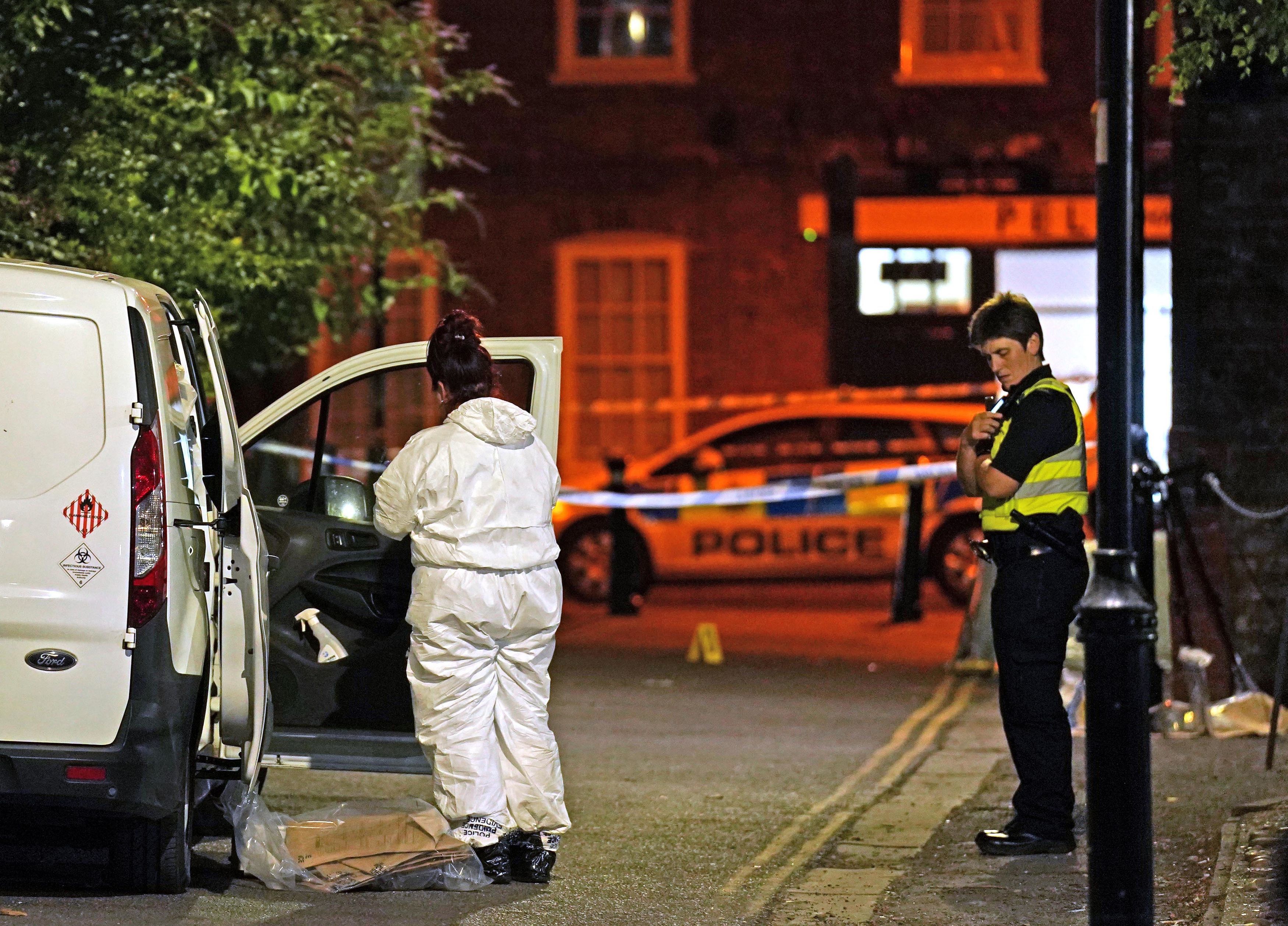 Police at the scene in Boston after a nine-year-old girl died from a suspected stab wound