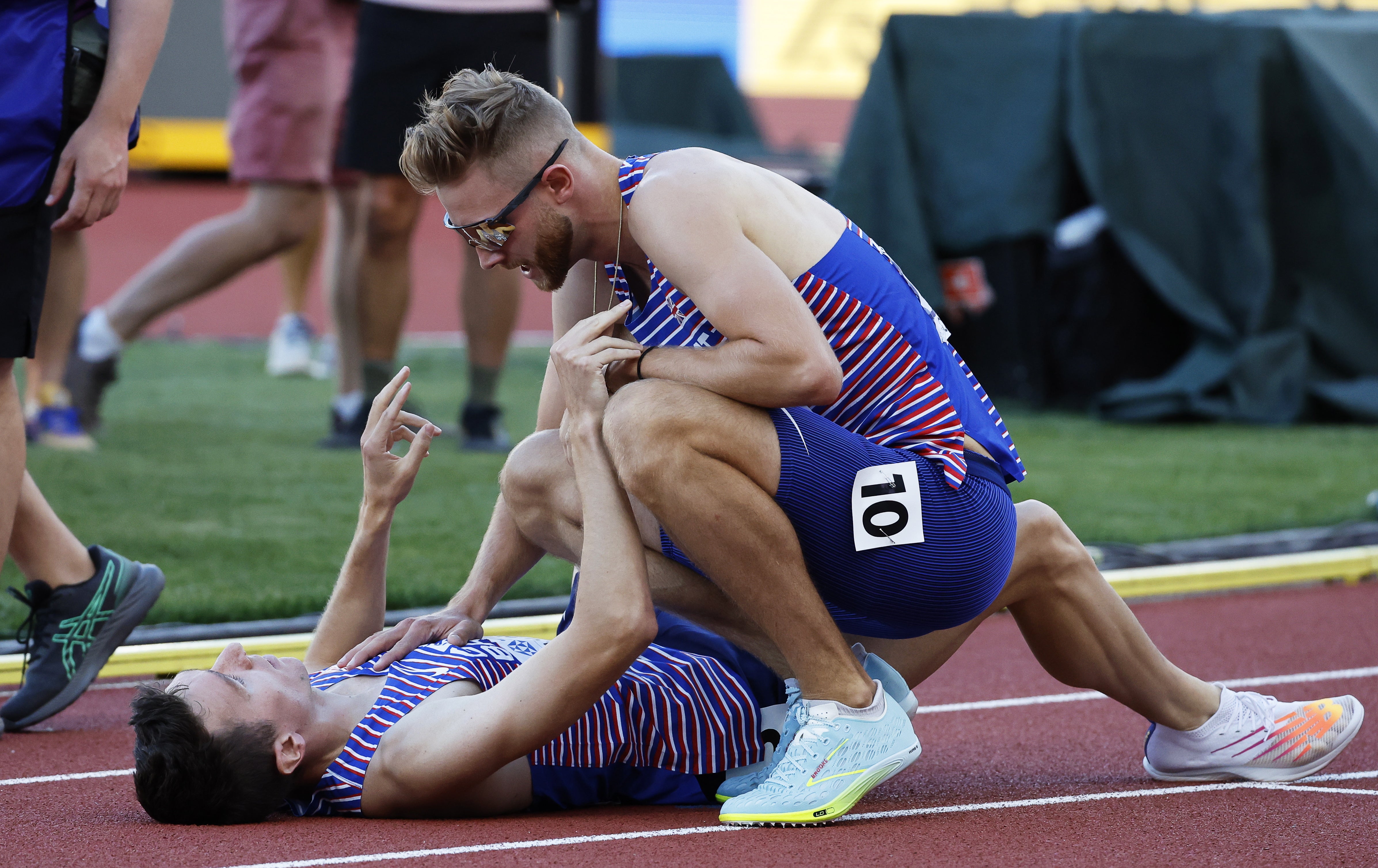 Jake Wightman is congratulated by his compatriot Josh Kerr