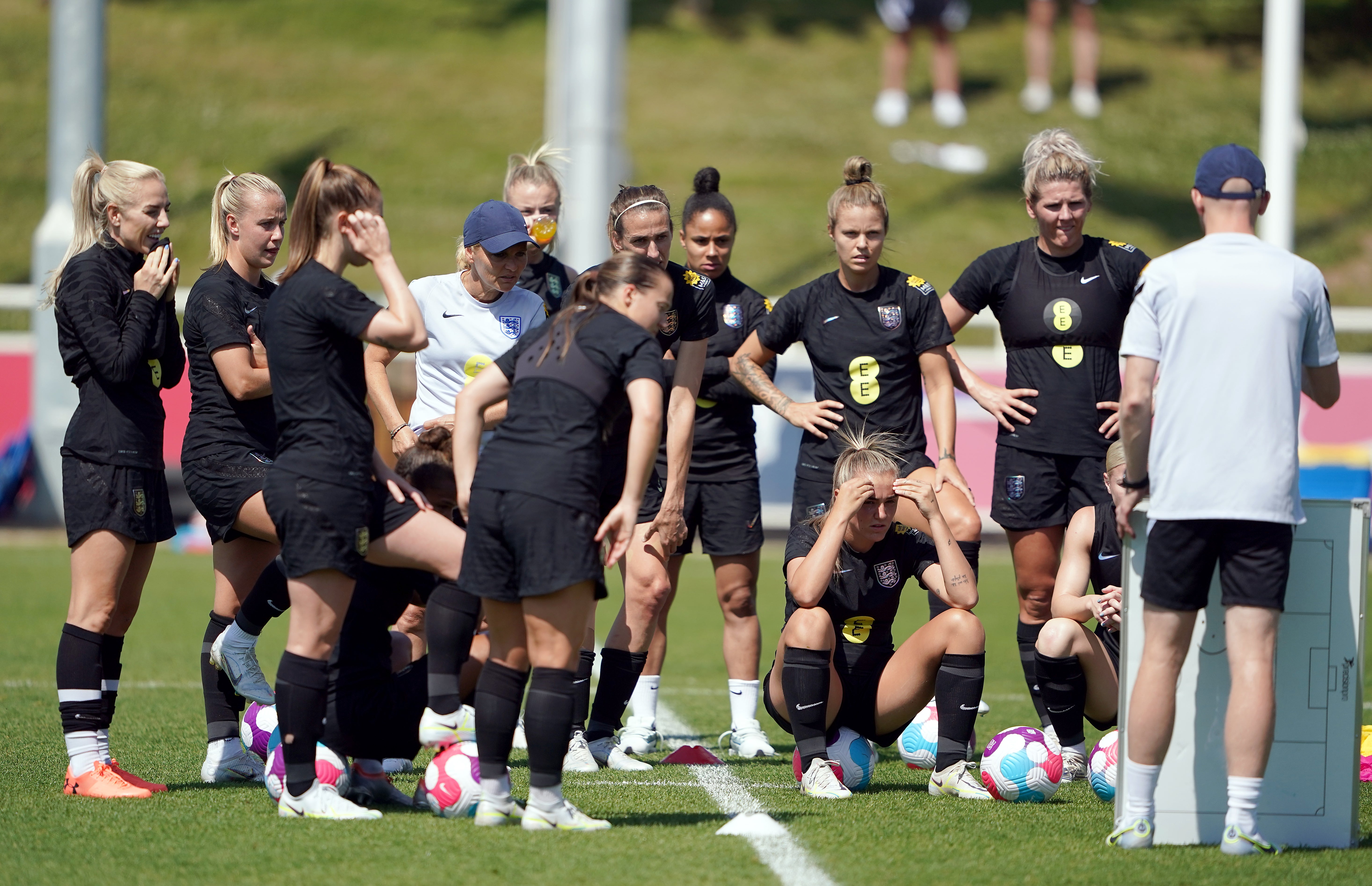 Sarina Wiegman, centre left, gives instructions to her England team in training (Zac Goodwin/PA)